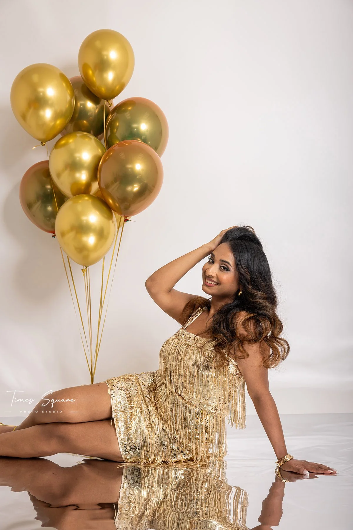 Stylish birthday studio portrait with custom balloon decor and elegant posing during a personalized NYC birthday photoshoot.