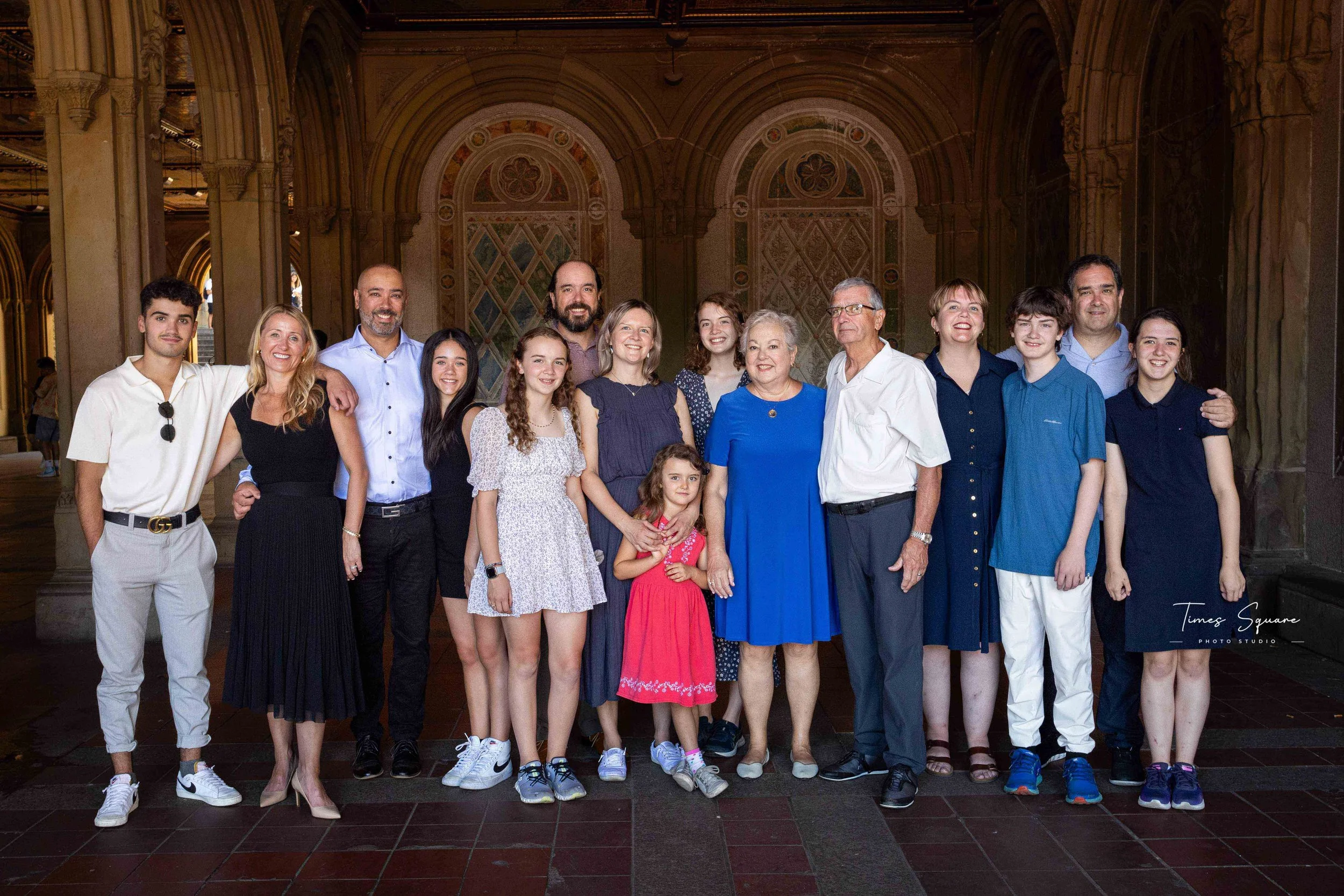 A big family reunion in New York City. Vacation photoshoot at the Bethesda Fountain, Central Park, New York