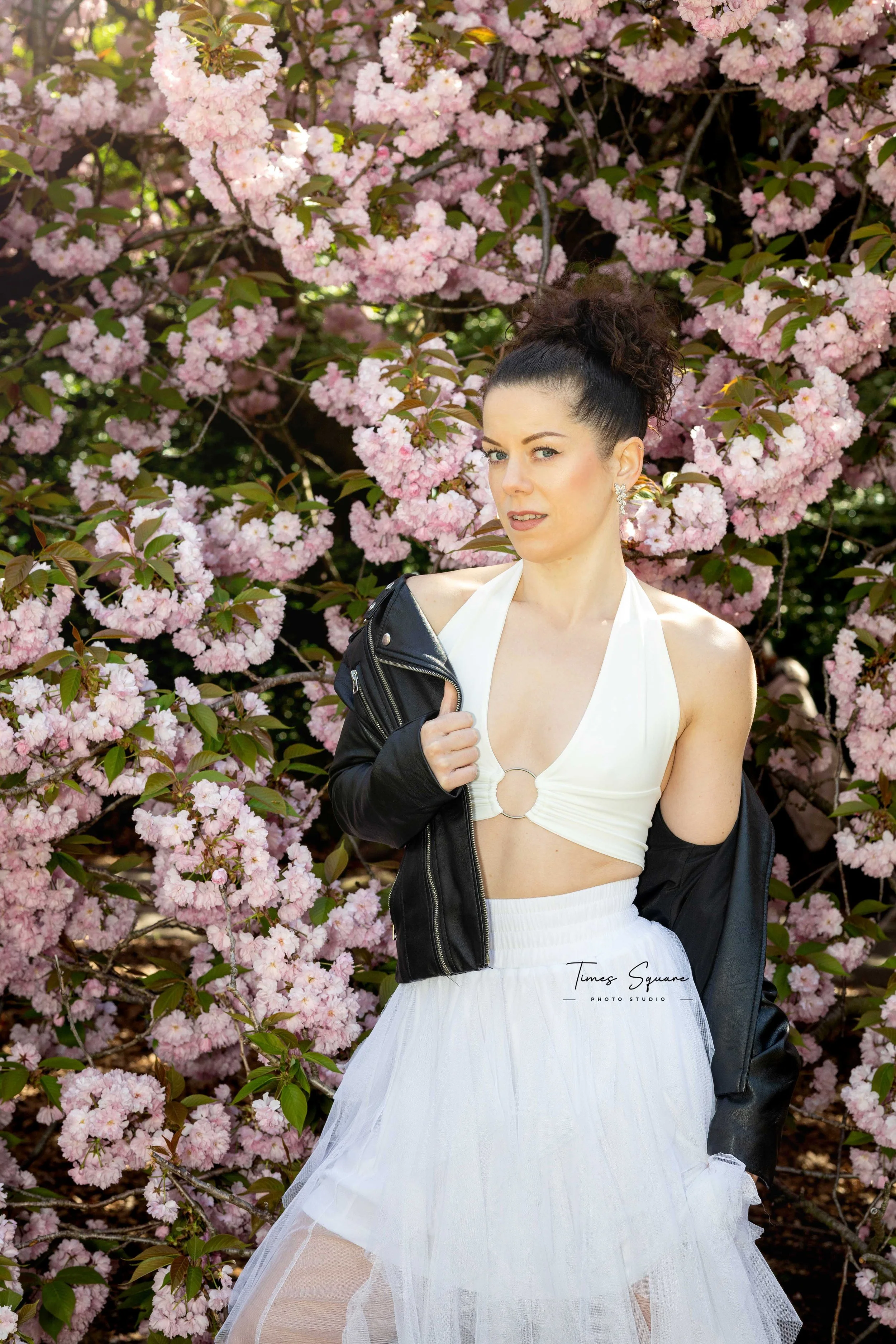 Lifestyle photoshoot for a woman during cherry blossom season at Brooklyn Botanic Garden in New York City.