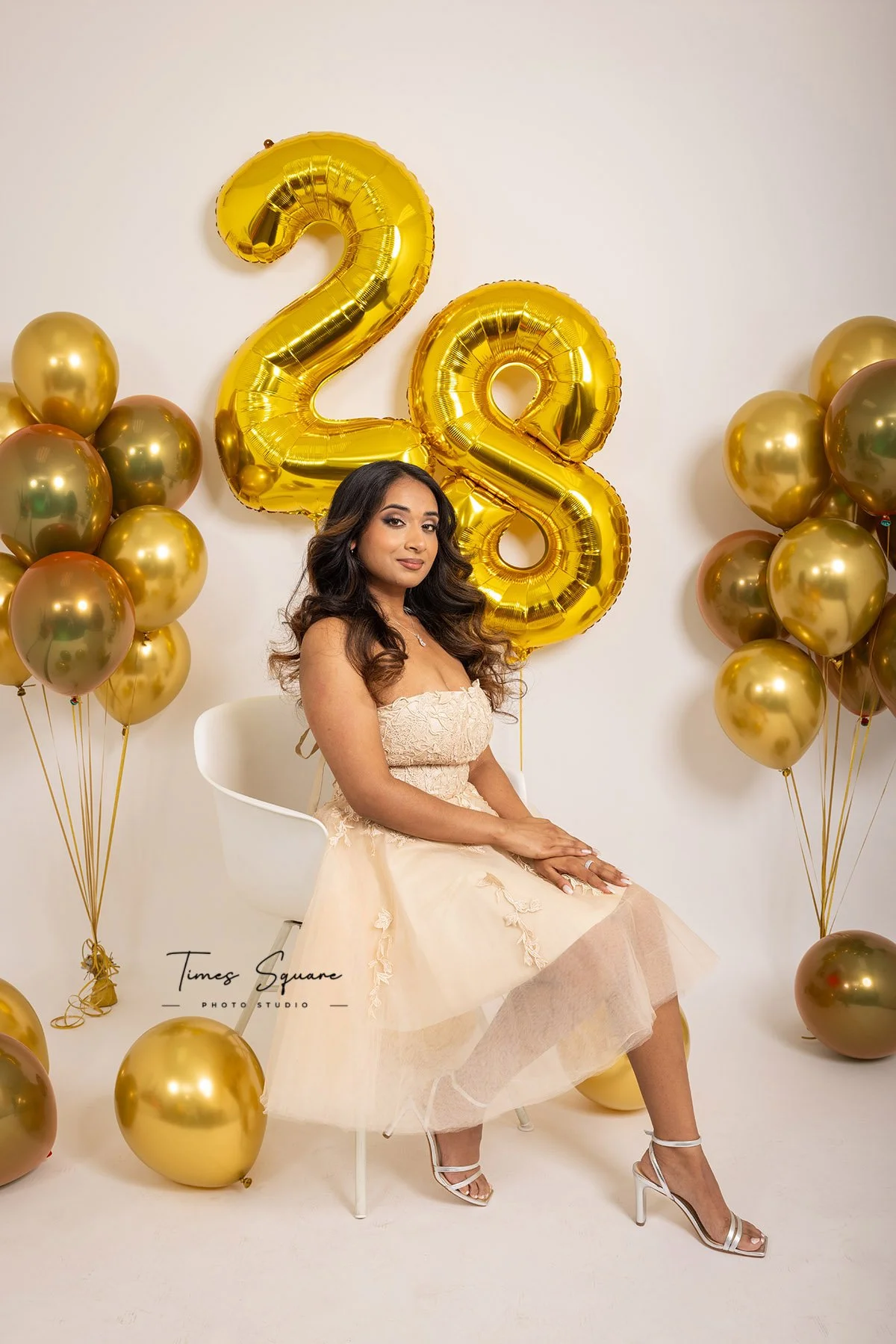for her birthday studio photoshoot in New York City. Gold decor