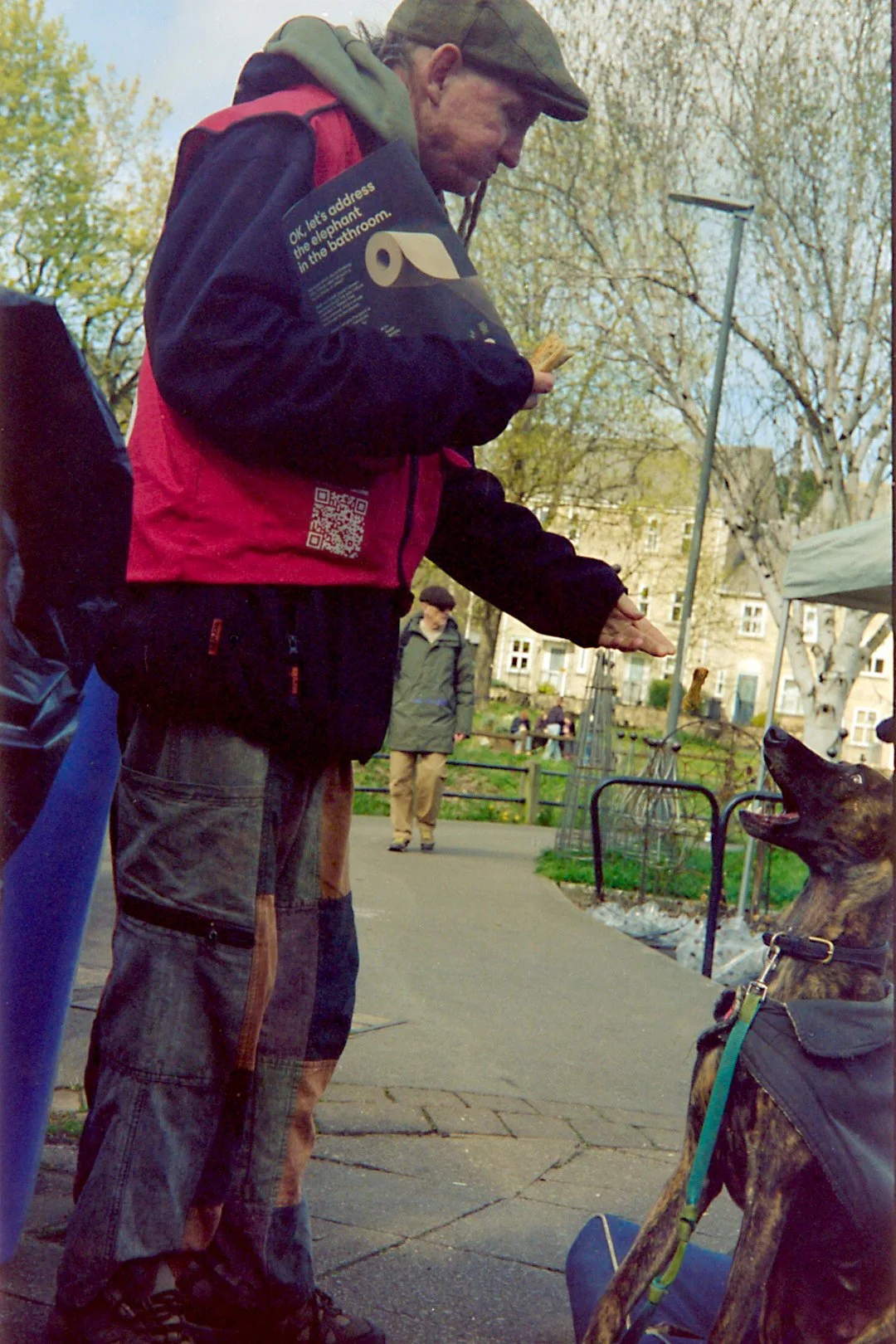 Big issue seller feeding his dog.jpg