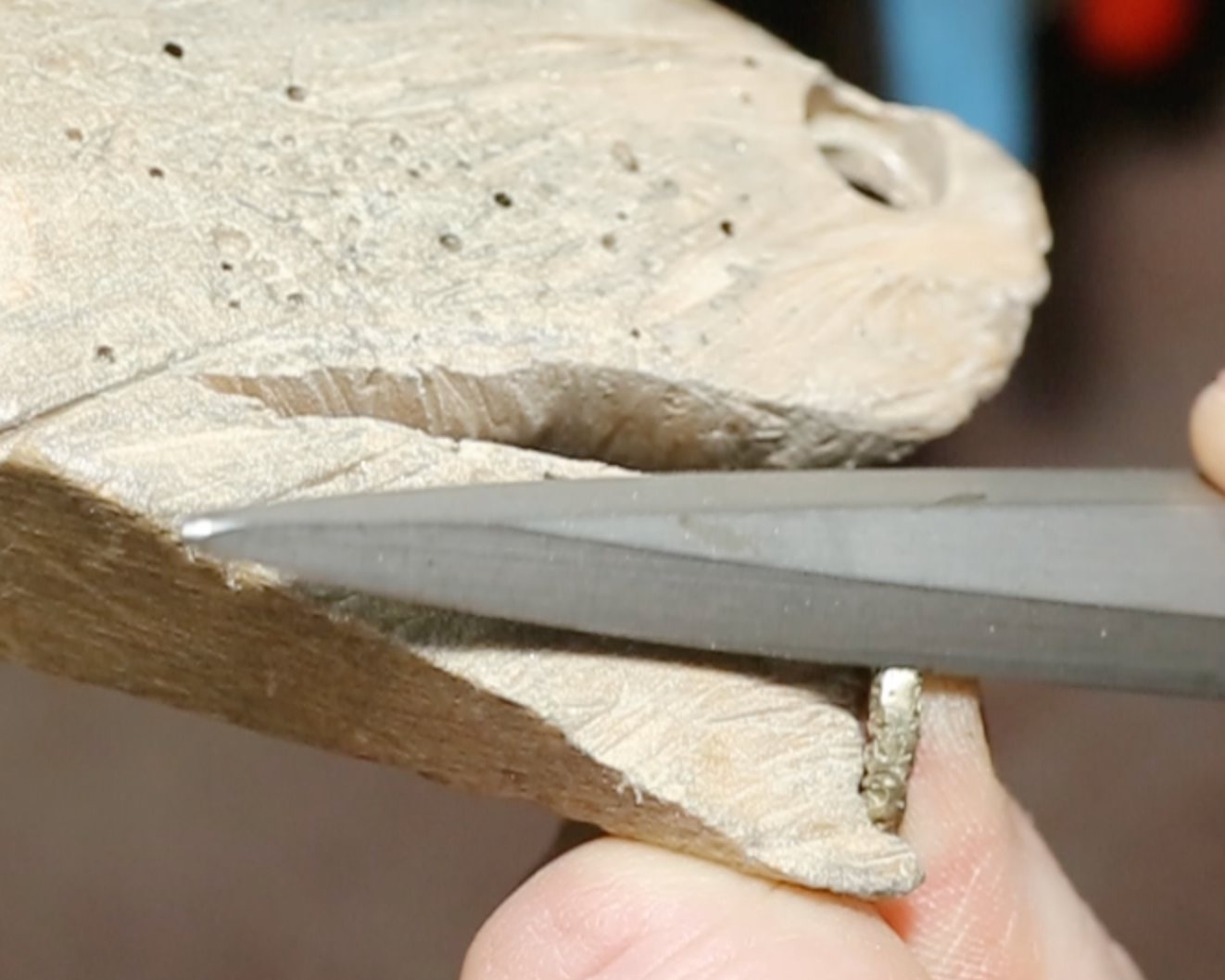 Close-up of filing a ring shank revealing detailed craftsmanship.