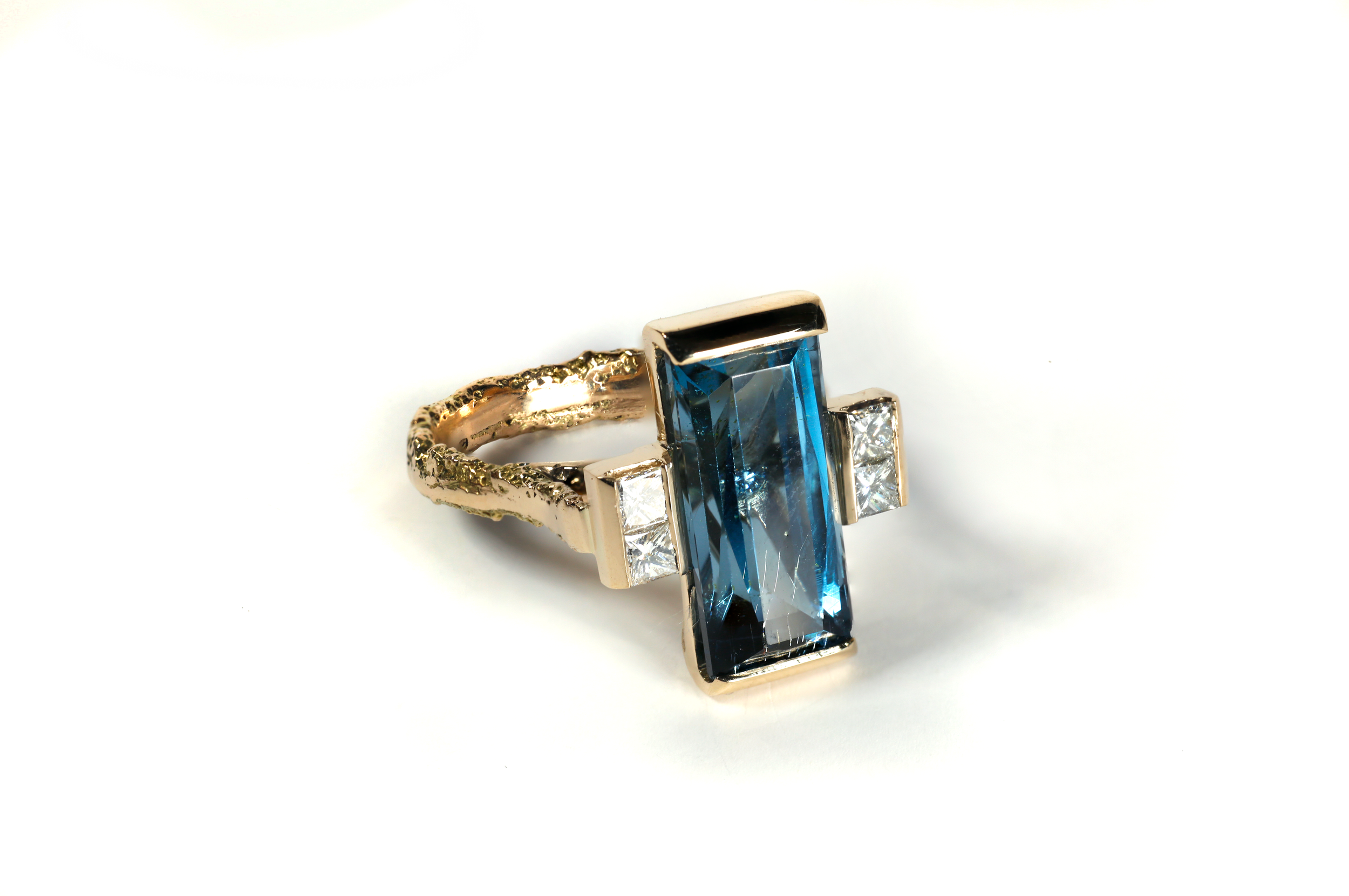 METROPOLIS RING 4 — The collection’s 14ct gold statement piece with Topaz & Ocean Diamonds