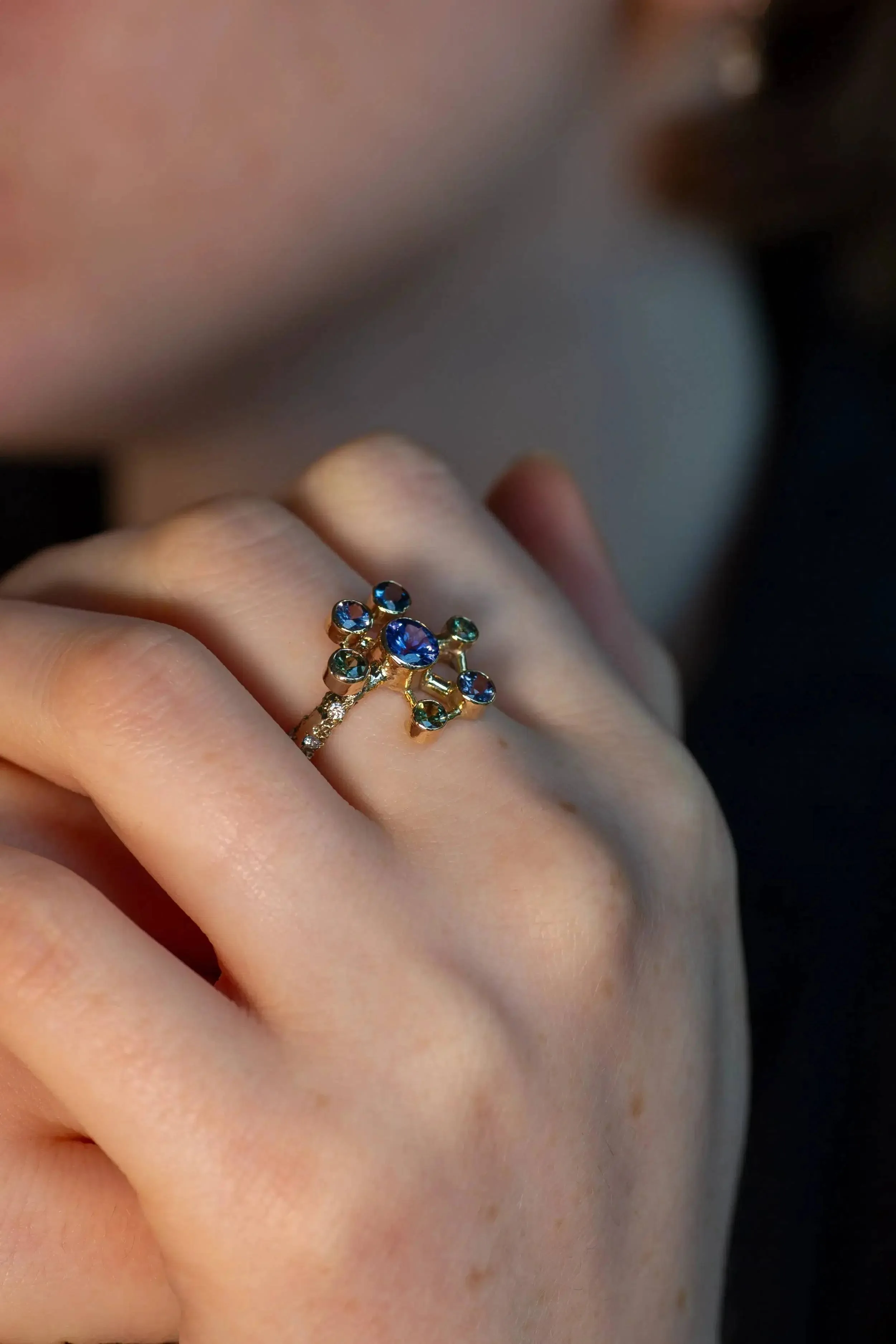 Atomium Ring No. 8 by Iain Sainsbury, 9ct SMO gold sandcast with Cornish Serpentine sand, set with Tanzanite, Sapphires, and Ocean Diamonds.