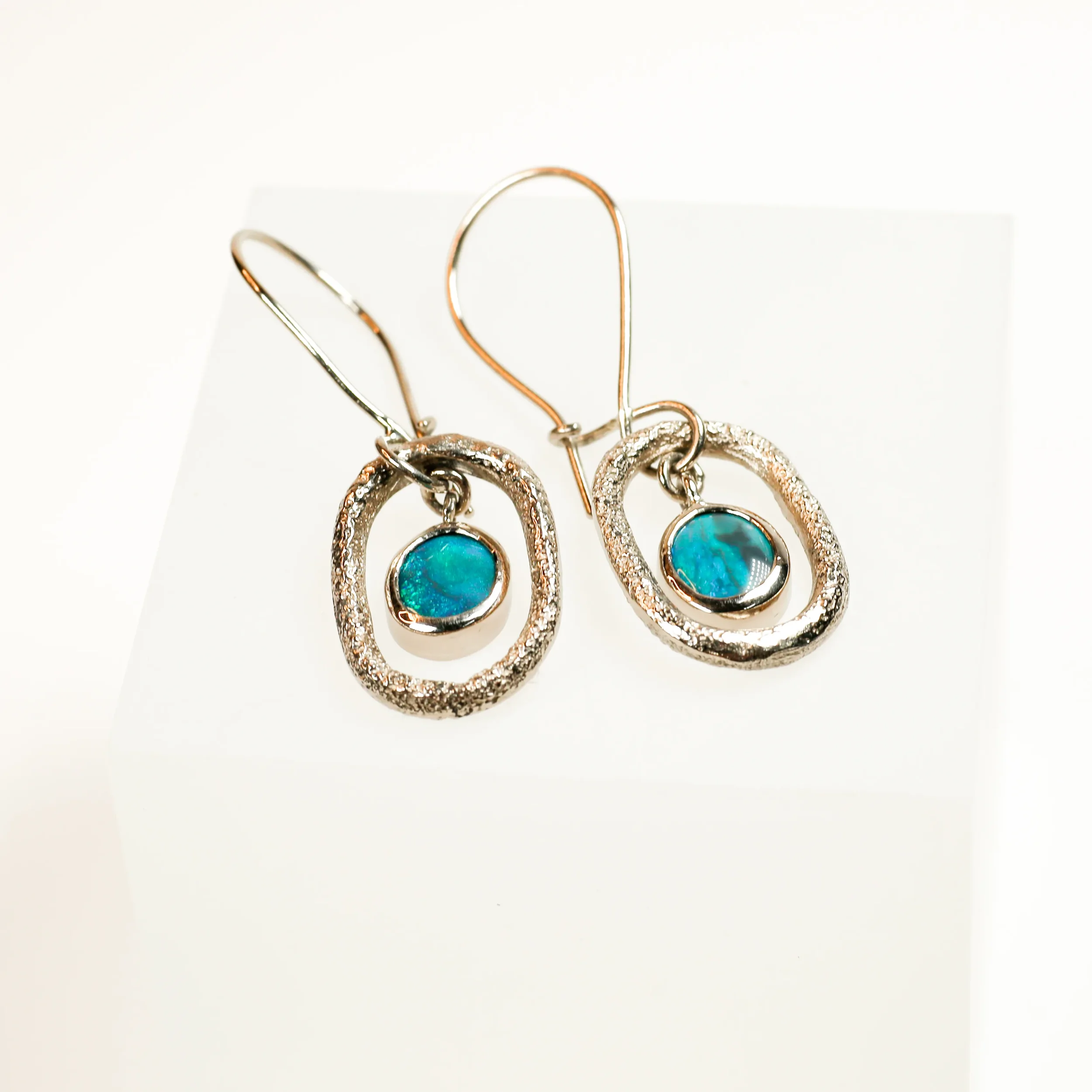 Bespoke 18ct SMO white gold earrings (natural colour no plating). Cast in customers sand from Croatia and set with beautiful green opals.