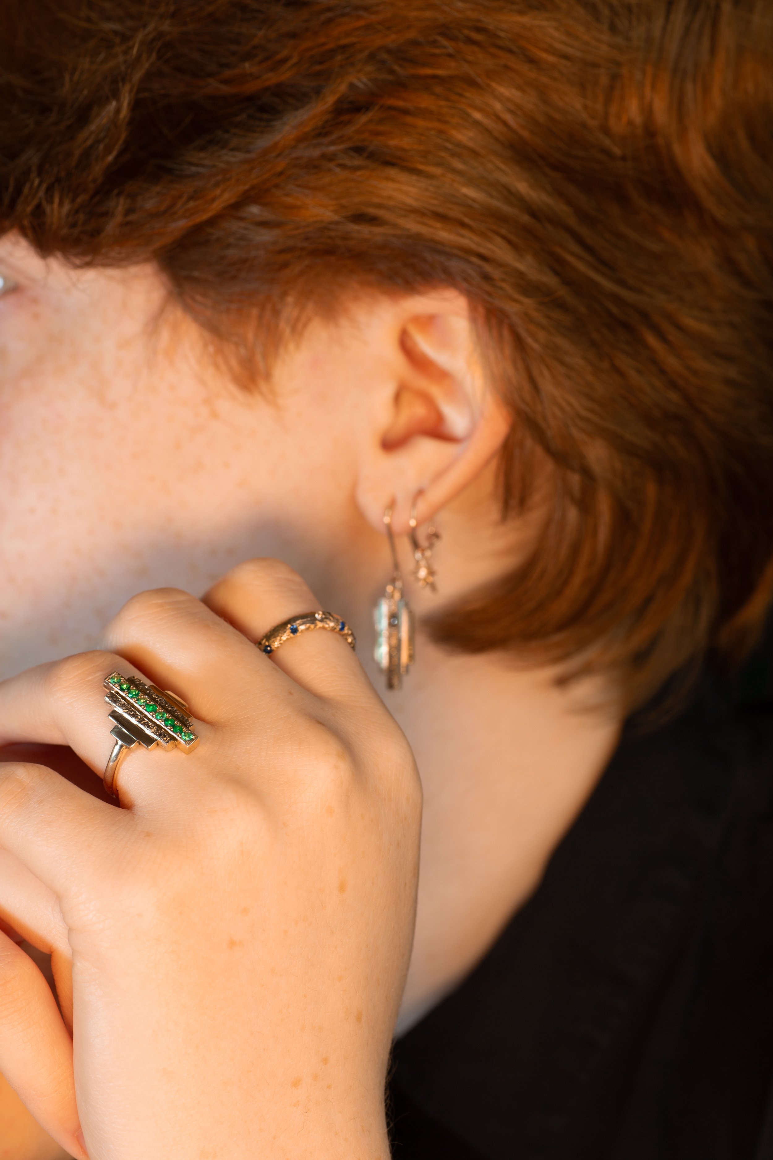 Bespoke SMO gold rings featuring a unique sand-cast texture and refined Art Deco geometric lines.