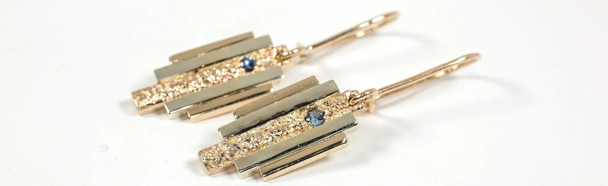 Two-tone mixed 9ct gold Art Deco drop earrings with Golden Ratio architectural bars and Cornish sandcast texture by Iain Sainsbury.