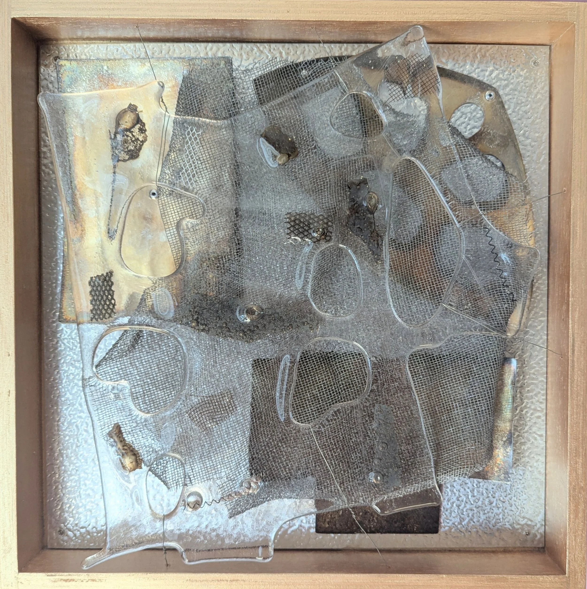 Behind Glass: Gold,
33x33x4cm, 2026.
Fused glass & found metal.