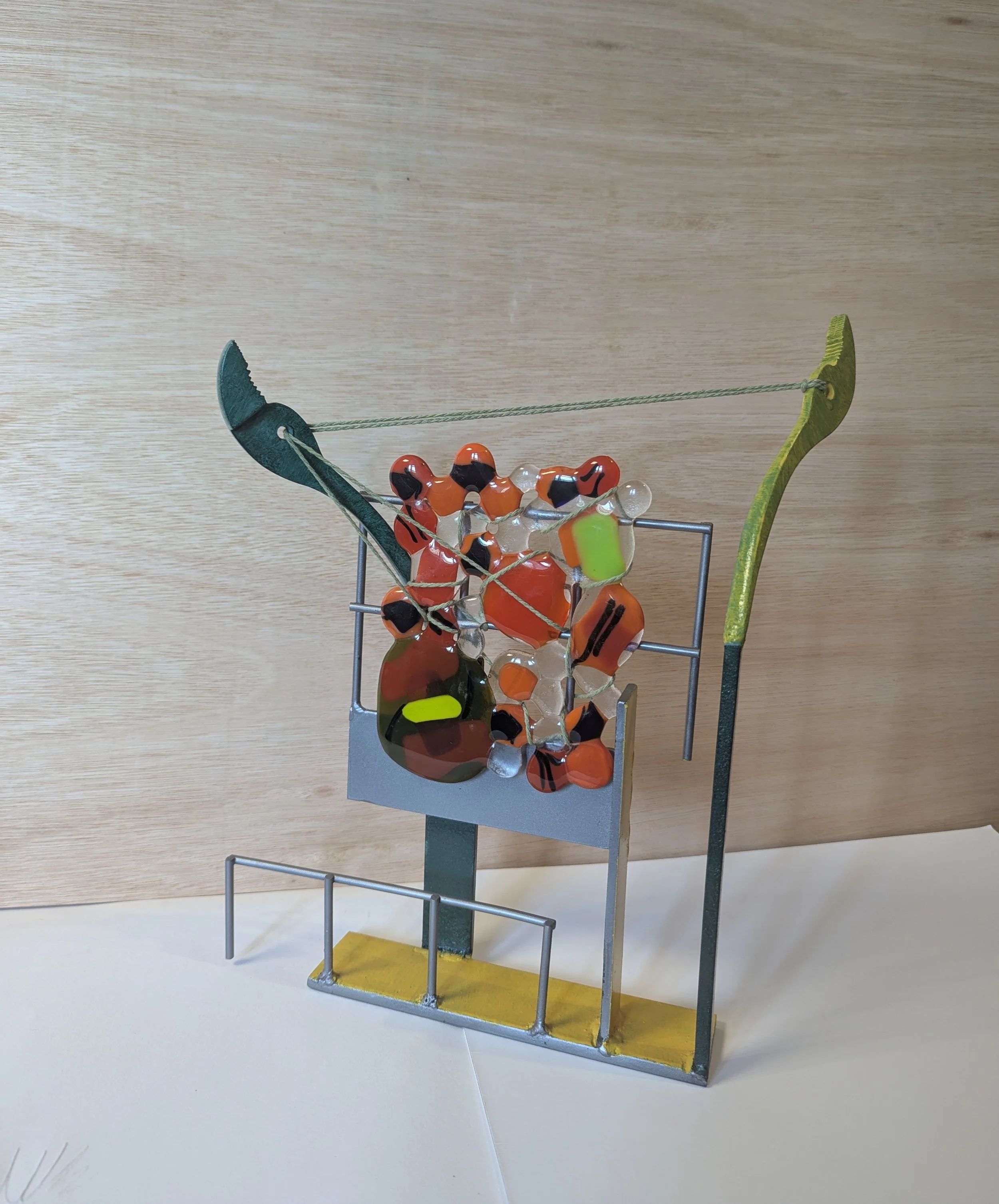 Tug, 2024, 37x25x9cm, reclaimed steel, fused glass and cotton yarn