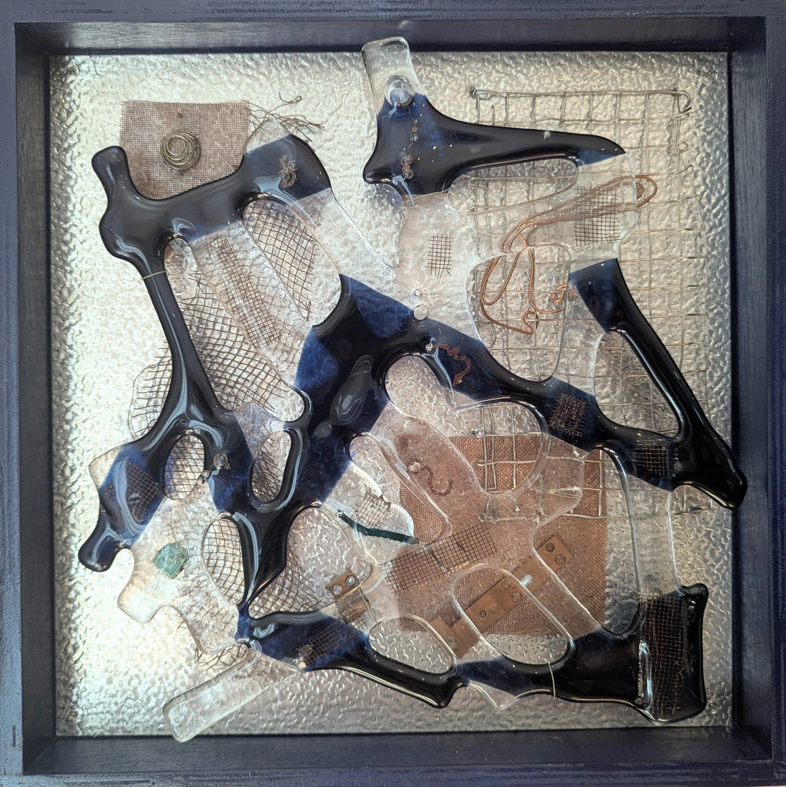 Behind Glass: Blue,
33x33x4cm, 2026.
Fused glass & found metal.
