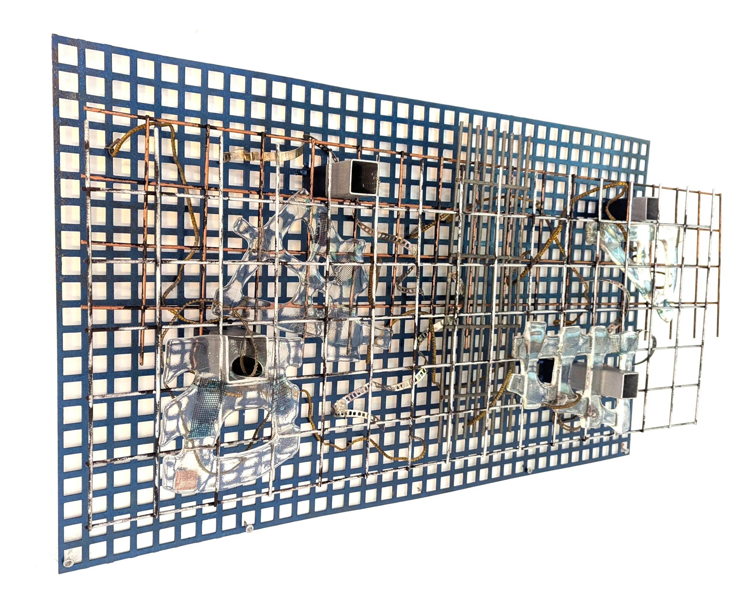 Water Table, 2025, 45x87x13cm, reclaimed metal grid, fused glass and found metal elements
