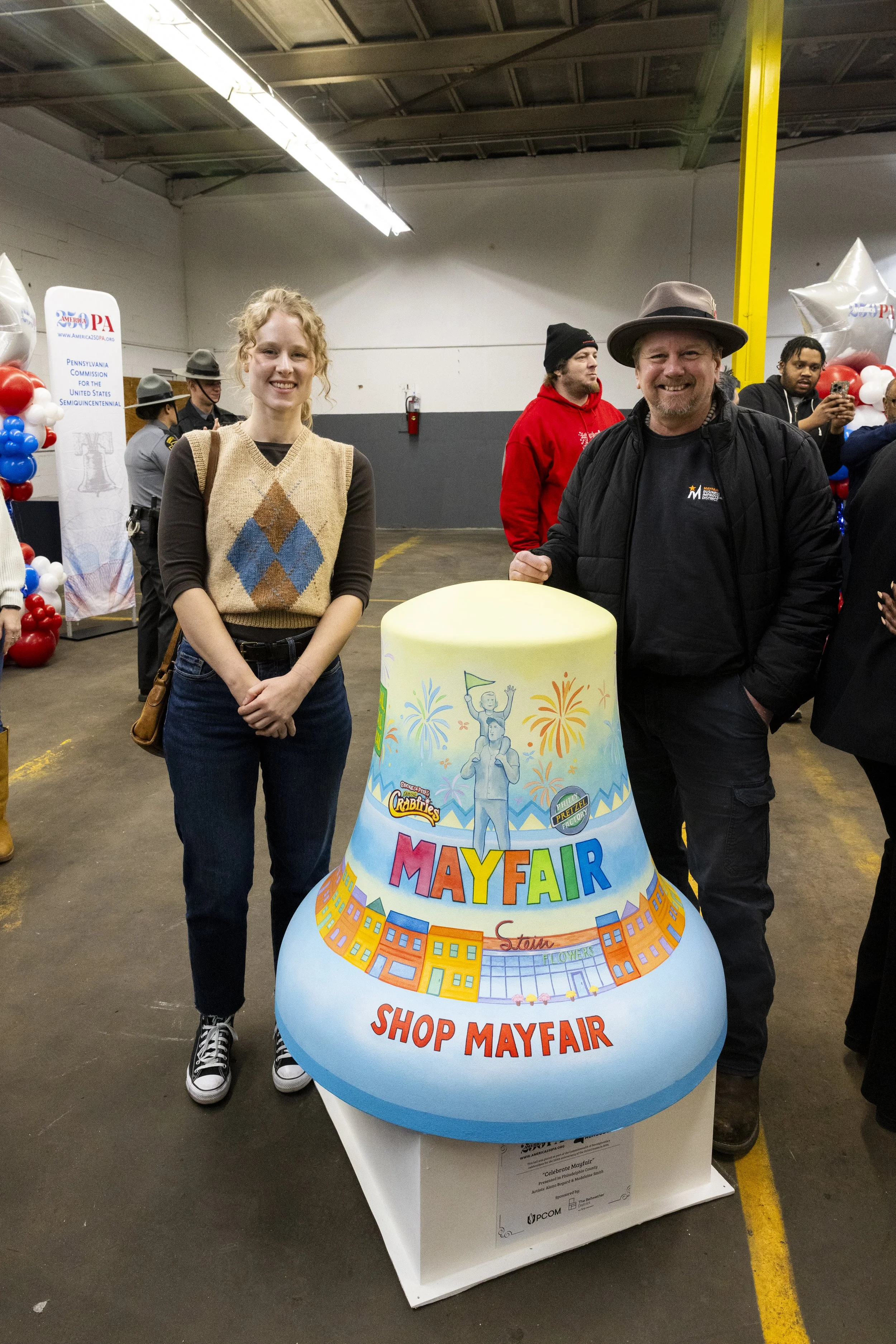 Lead Muralist unveiling bell with Mayfair's Business Improvement District Executive Director, Donny Smith Photo Credit: Gustavo Garcia, Colibri Workshop