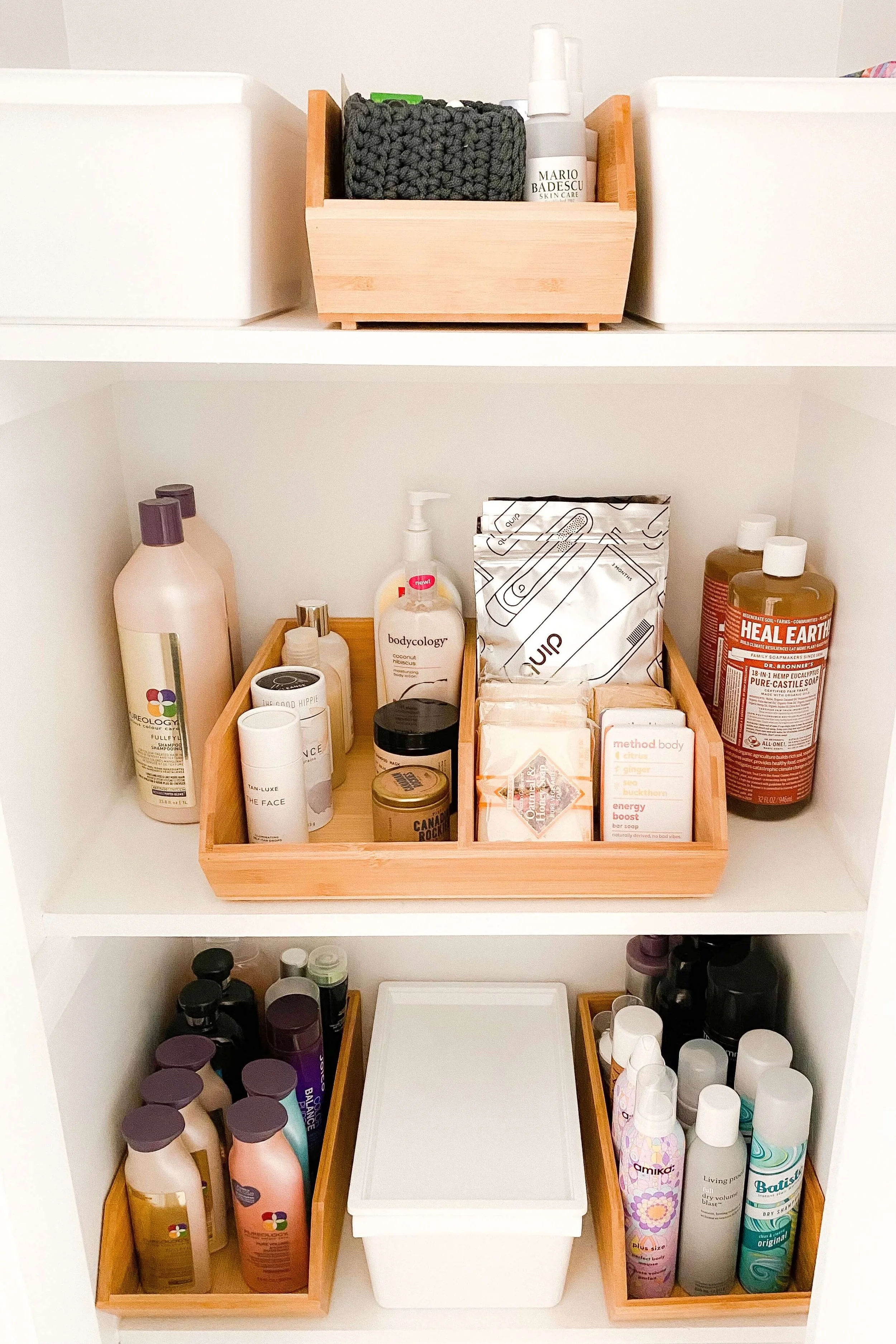 Tidy bathroom toiletries stored in bamboo organizing containers