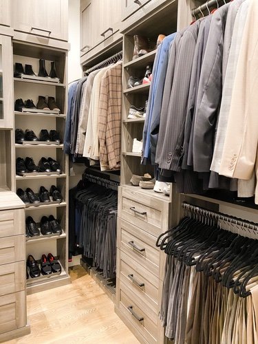 Men's clothing organized in a closet