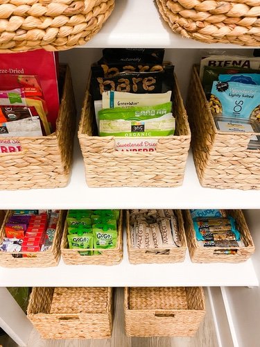 Snacks organized in pantry baskets