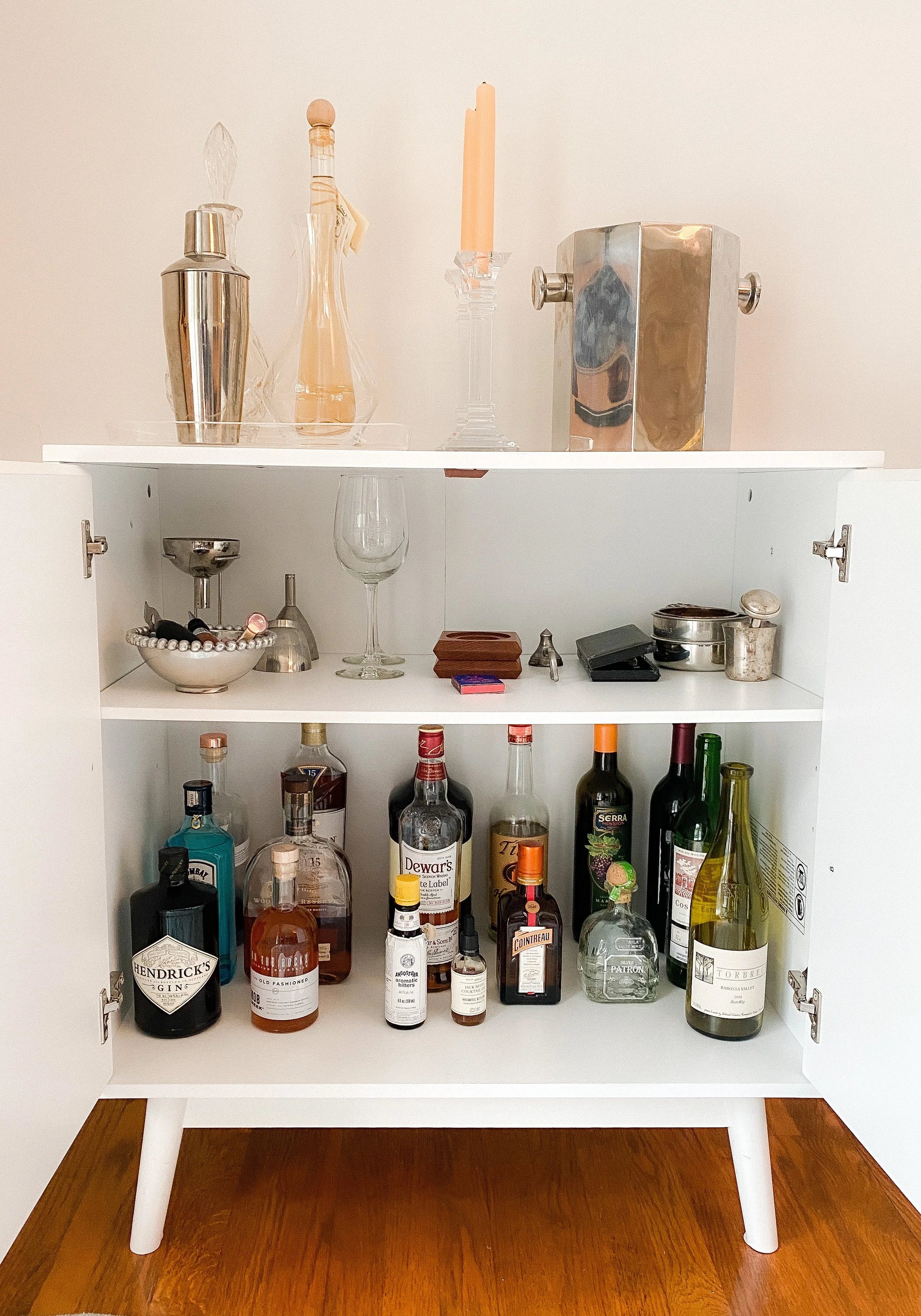After: Clutter transformed into a tidy bar cabinet, perfect for entertaining
