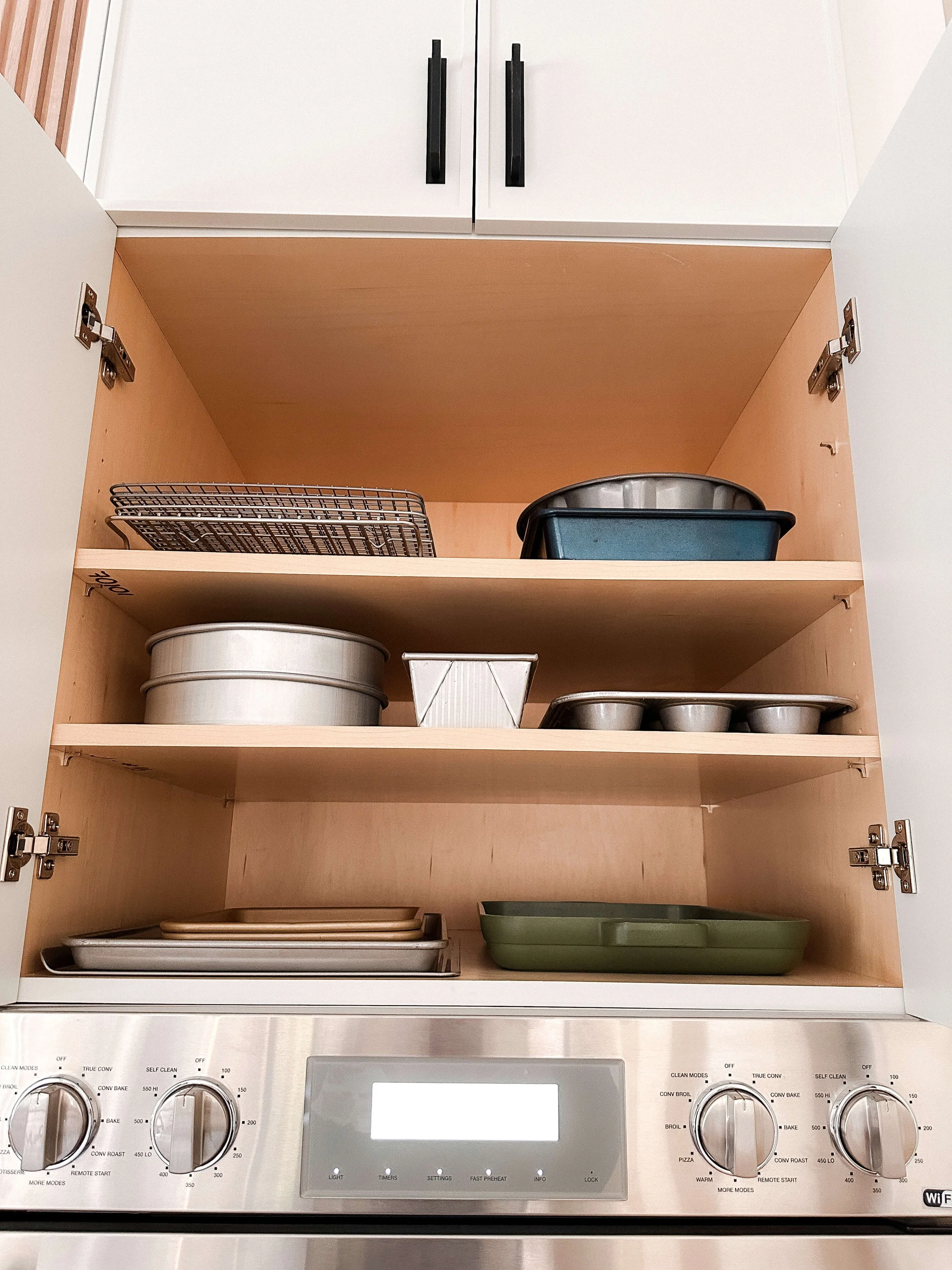 Baking pans neatly organized and ready to use.