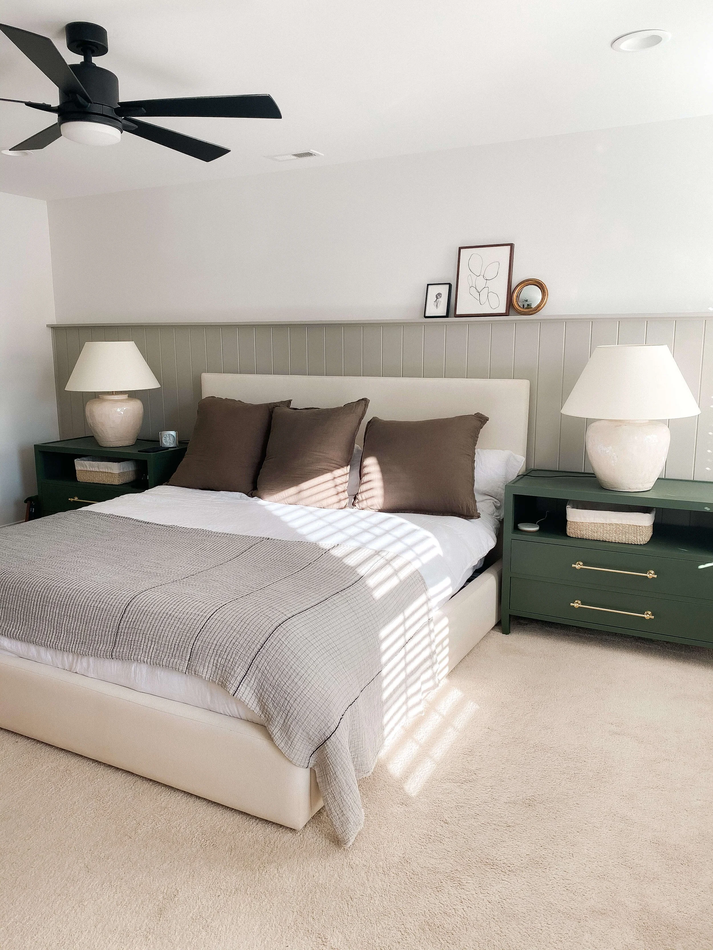 Guest bedroom with neatly made bed and organized furnishings