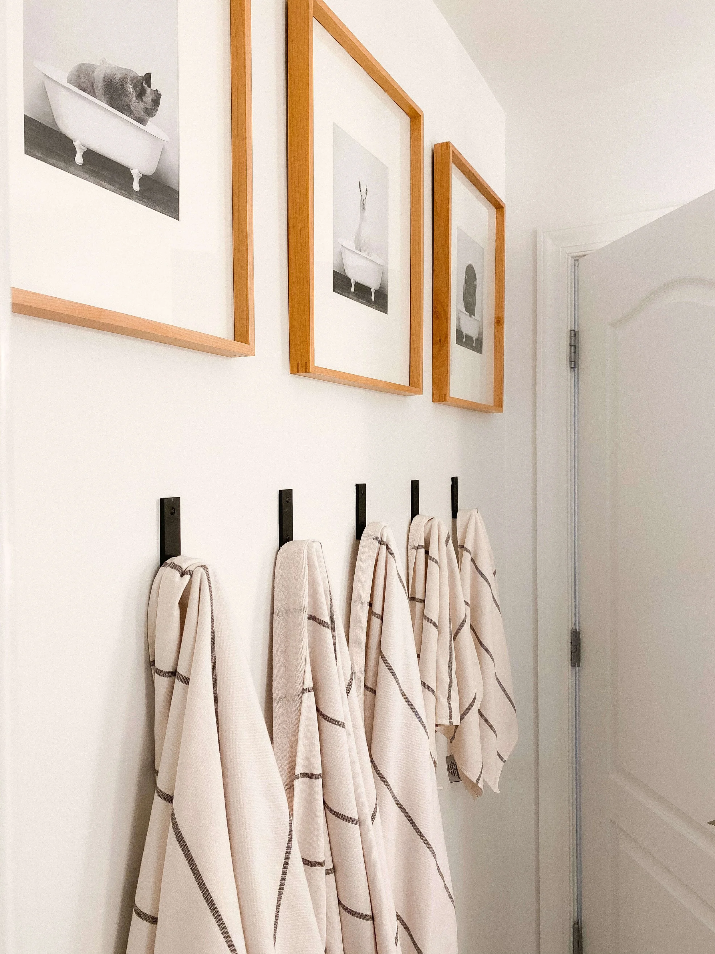 Bathroom wall hooks with neatly hung guest towels