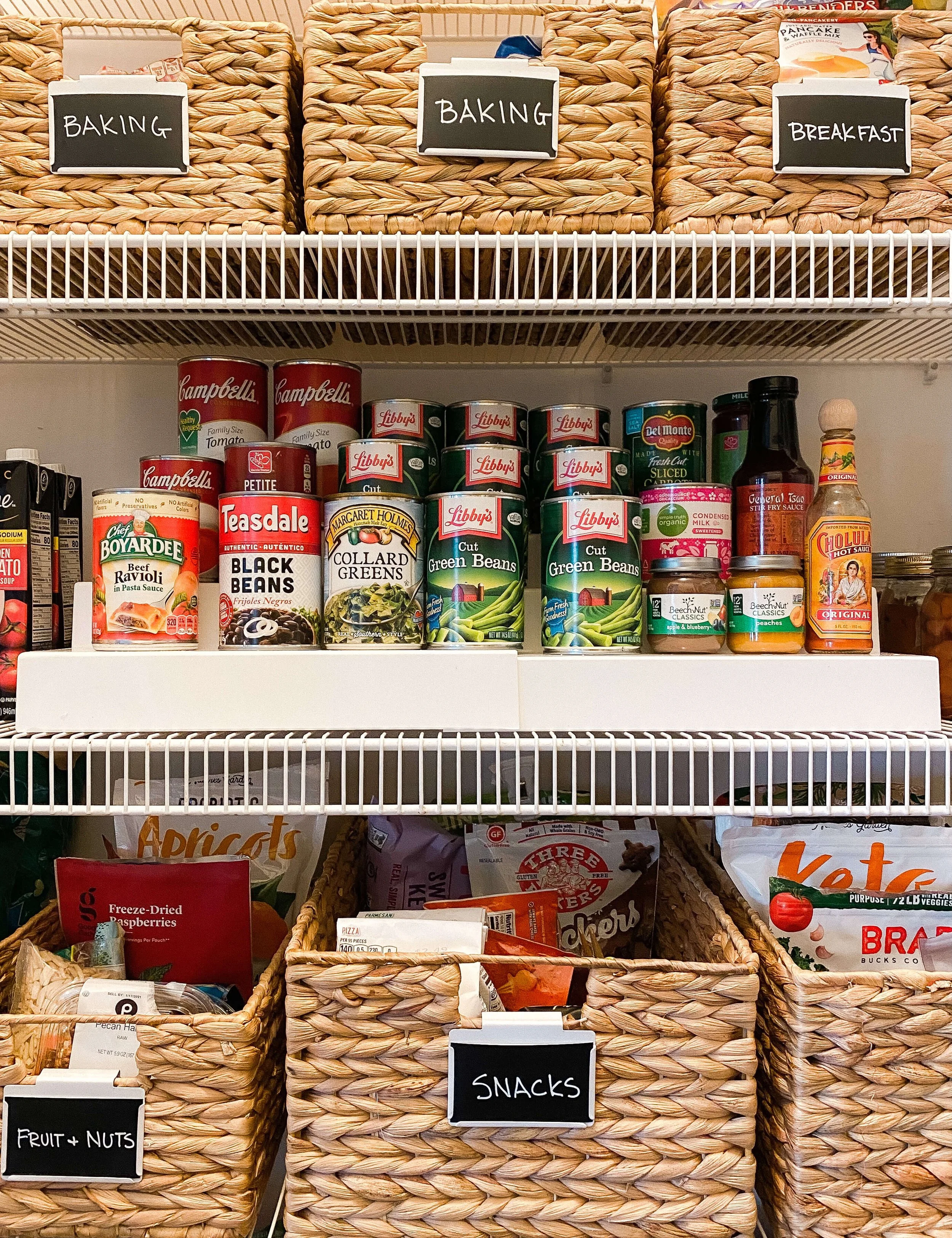  Pantry baskets labeled Baking and Breakfast above neatly arranged canned goods 