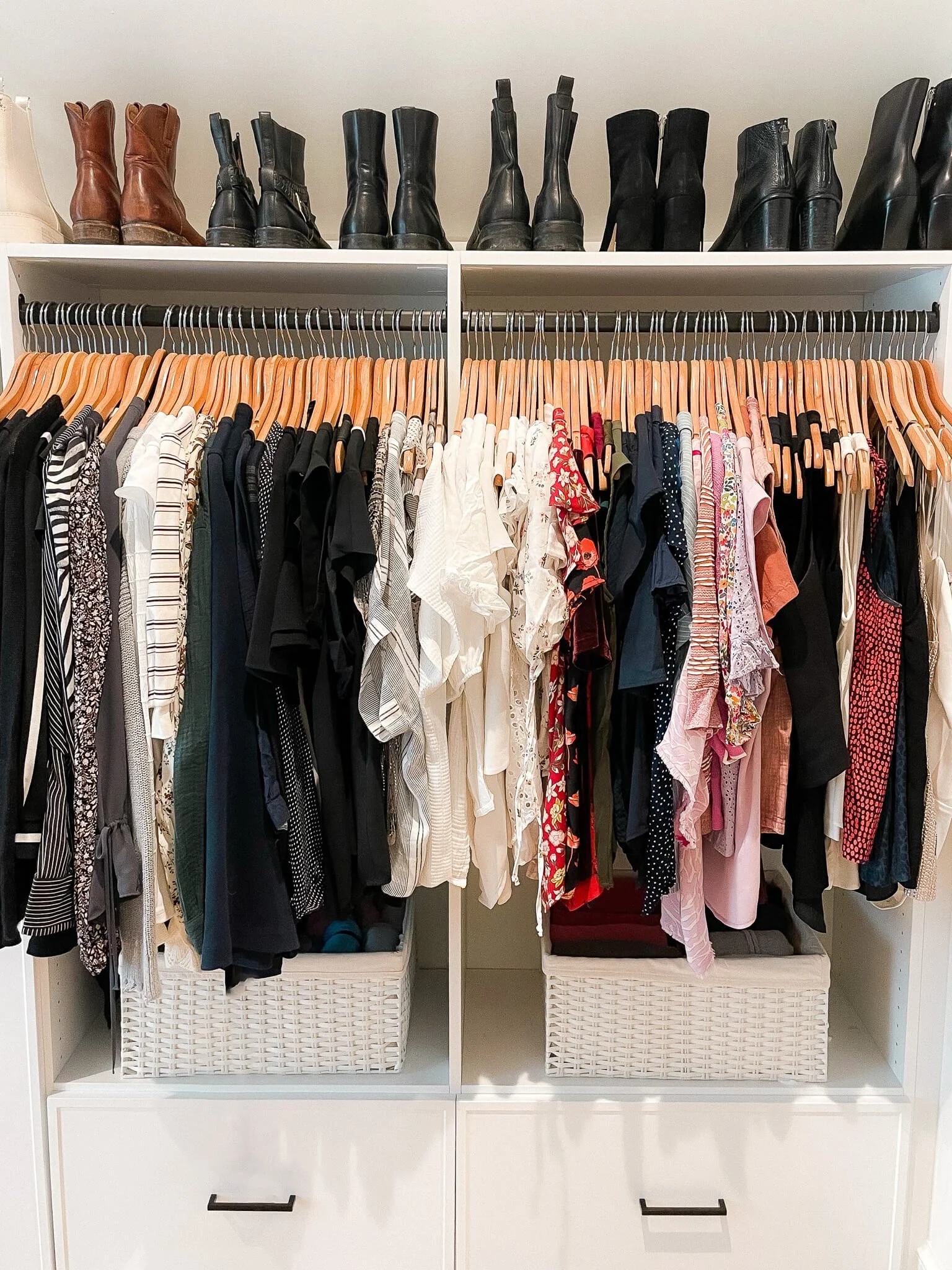 Raleigh, NC professional organizers creating an organized walk-in closet