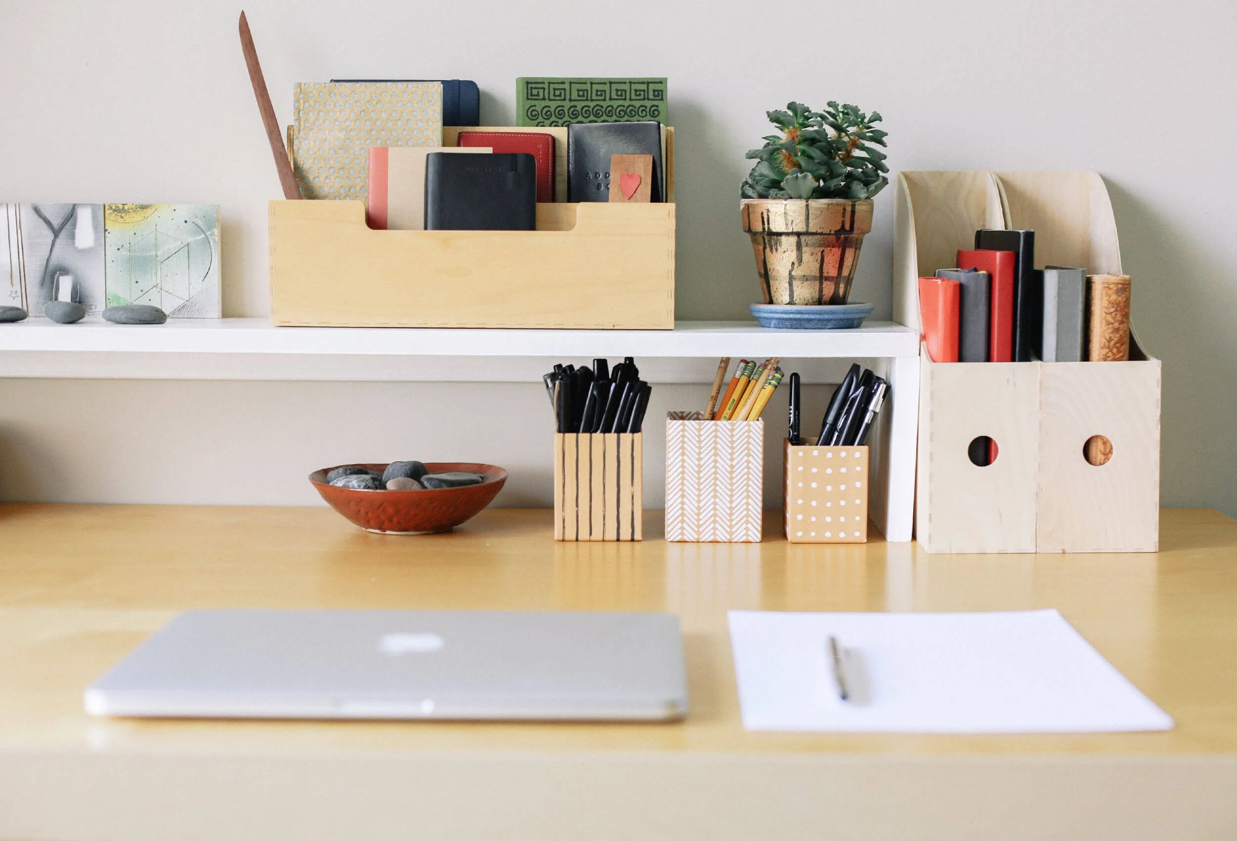 Organized office desk with laptop and wooden supply sorters by Simplify Studio business organizing service in Raleigh, NC