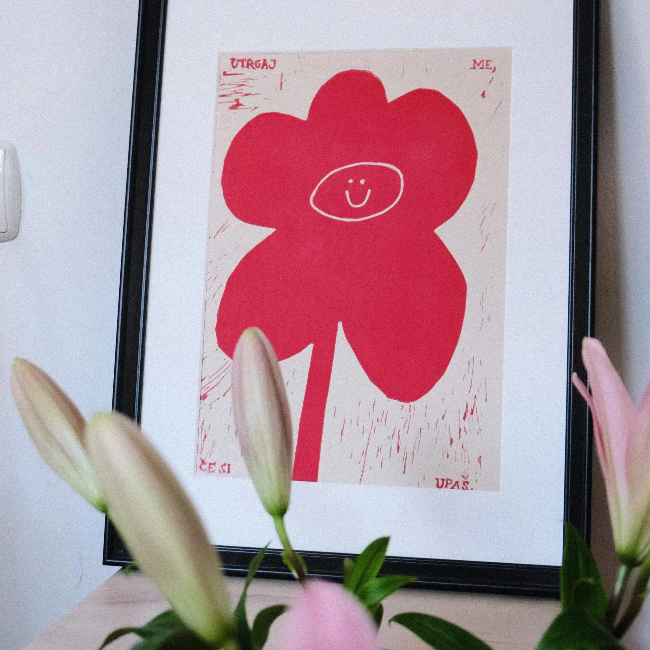 Minimalist red flower print with a smiley face, modern playful floral wall art poster_MALA-MAJA
