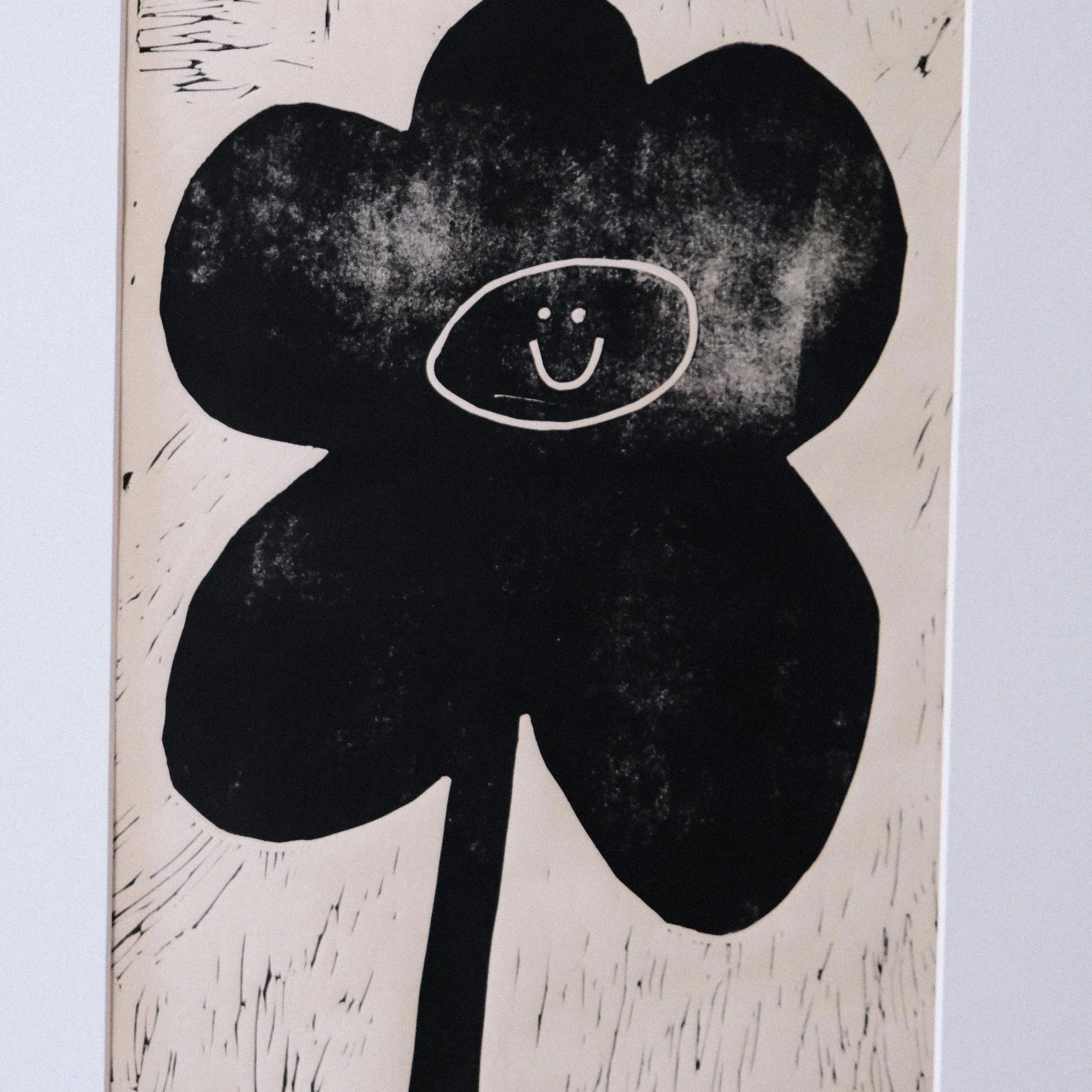 Minimalist black flower print with a smiley face, modern playful floral wall art poster