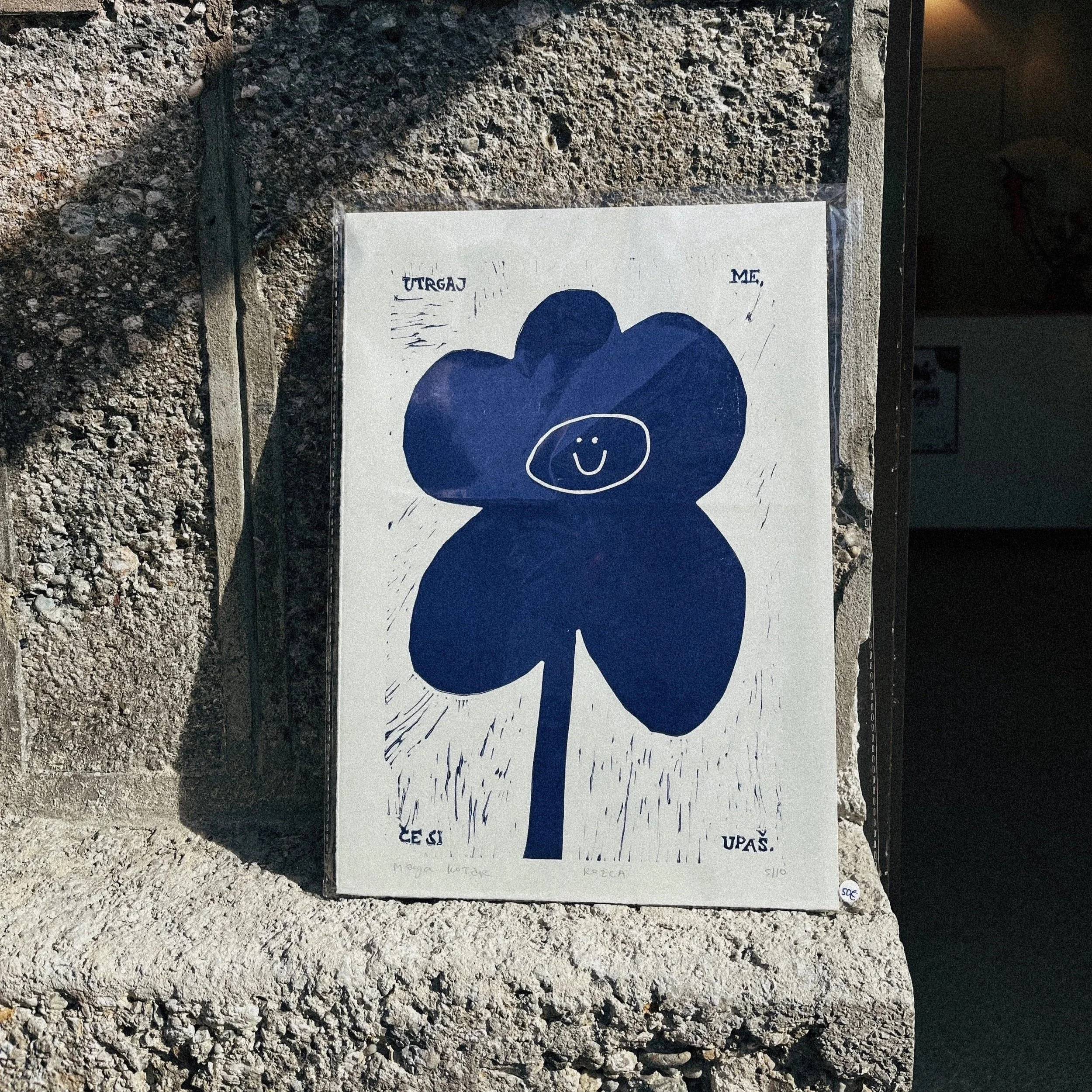Minimalist blue flower print with a smiley face, modern playful floral wall art poster_MALA-MAJA