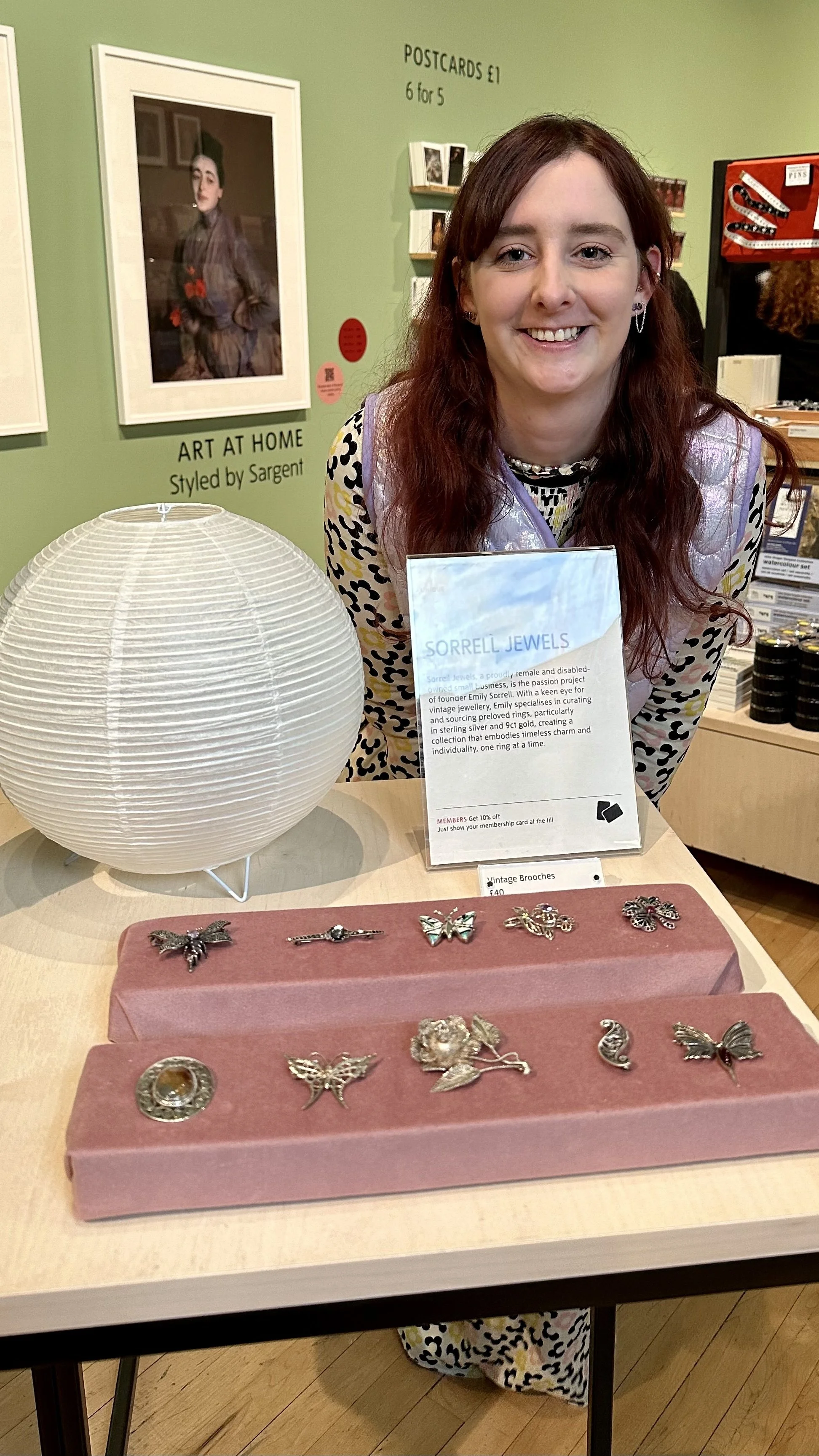 Emily Sorrell at a Sorrell Jewels market stall, displaying curated vintage rings and jewellery collections at a pop-up event.