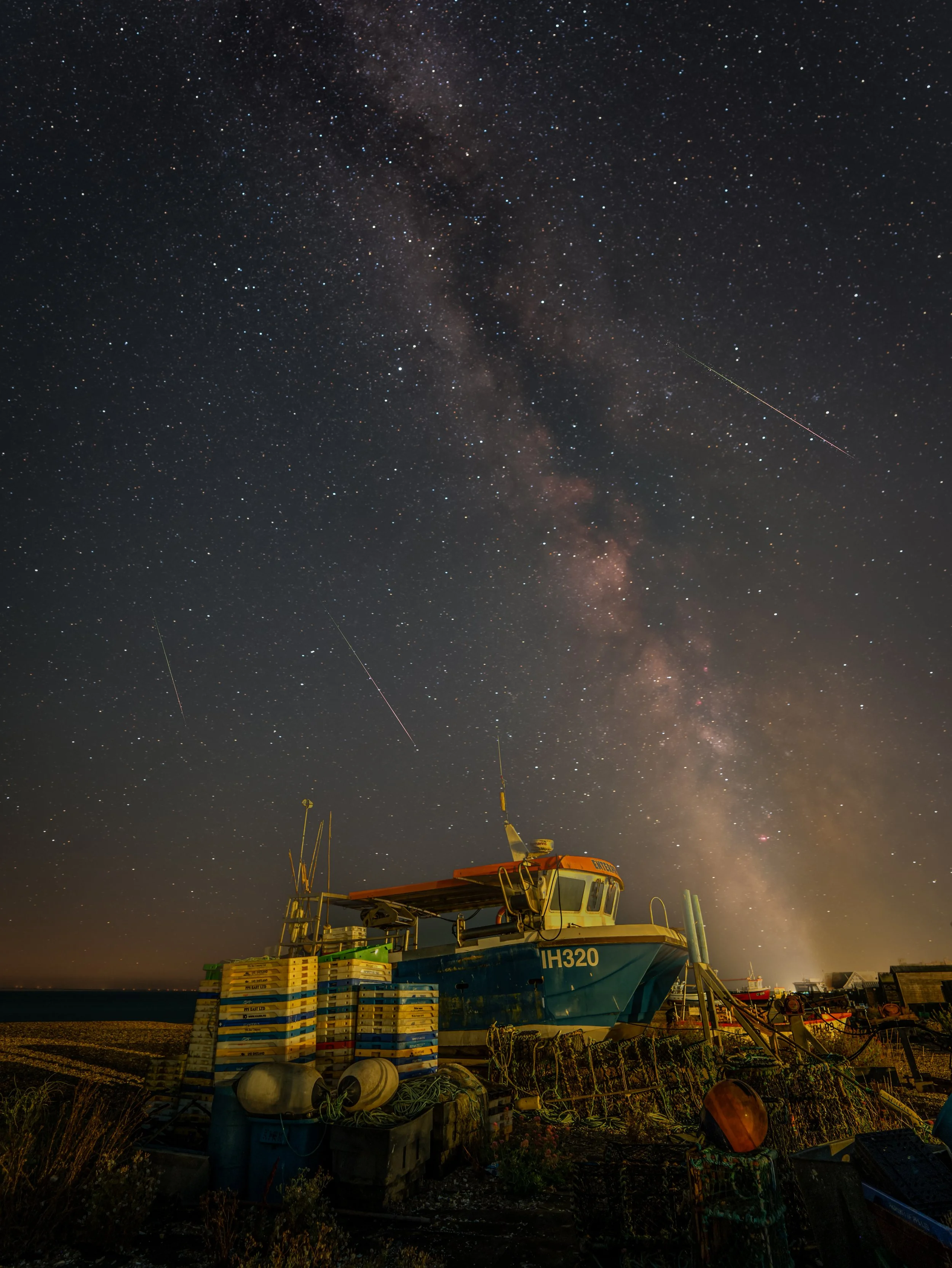 Several prominent Perseid meteors streak across the sky over Aldeburgh beach and the Milky Way.  August, 2026