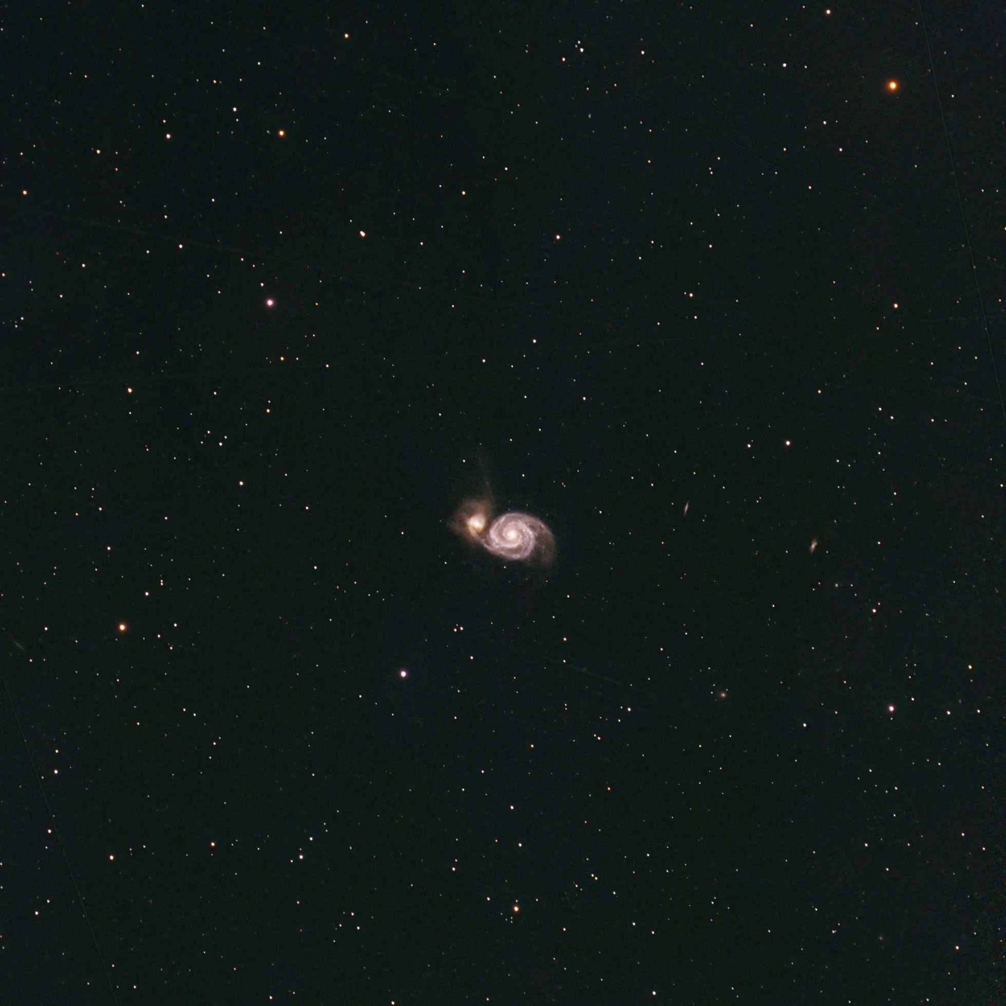 M51, the Whirlpool galaxy, an interacting grand design spiral galaxy in the constellation Canes Venatici.  Located about 31 million light years away, the larger Whirlpool galaxy is interacting gravitationally with its smaller neighbor, NGC 5194.