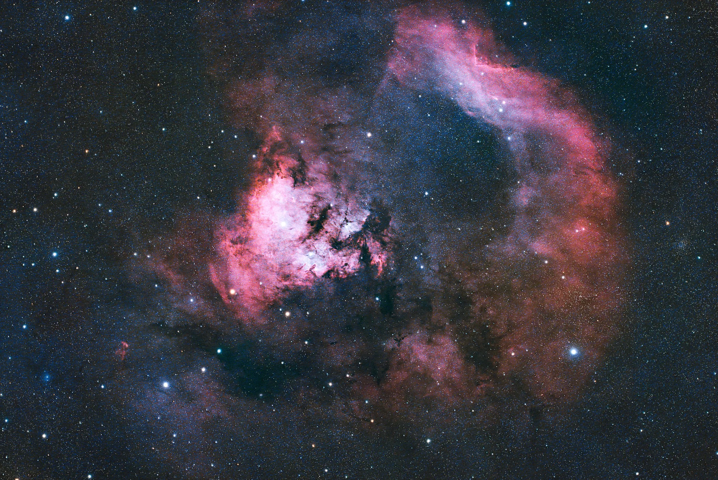 The Question Mark nebula, a vibrant, star forming emission nebula approximately 3,000 light years away in the constellation Cepheus.