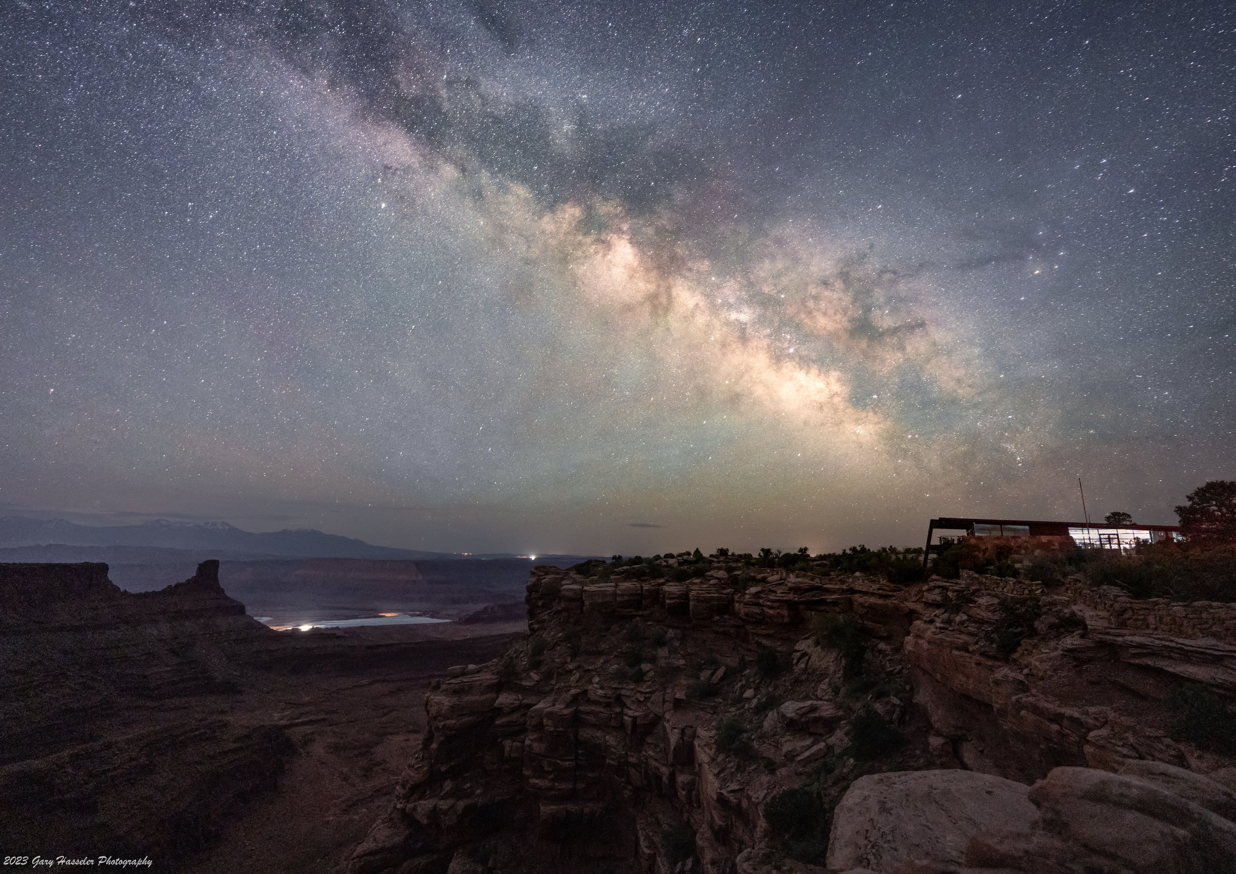 The Milky Way rising over the Visitor Centre at Deadhorse Point state Park in Utah. May.