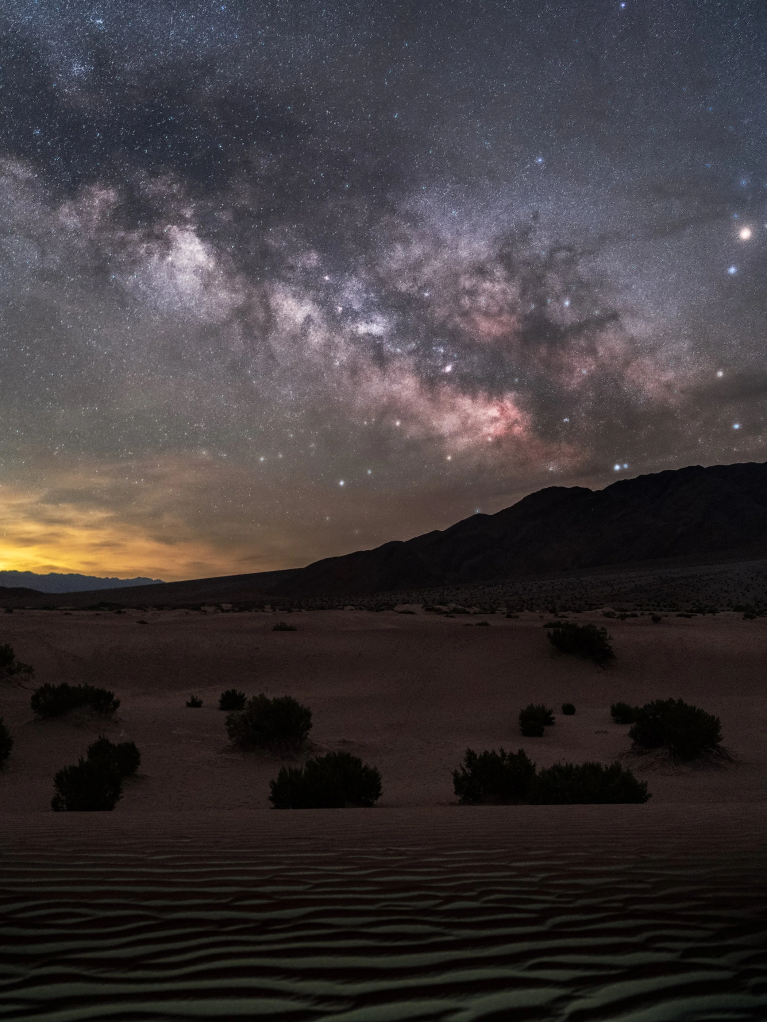 The Milky Way galactic core over Mesquite Dunes in Death Valley, California.  