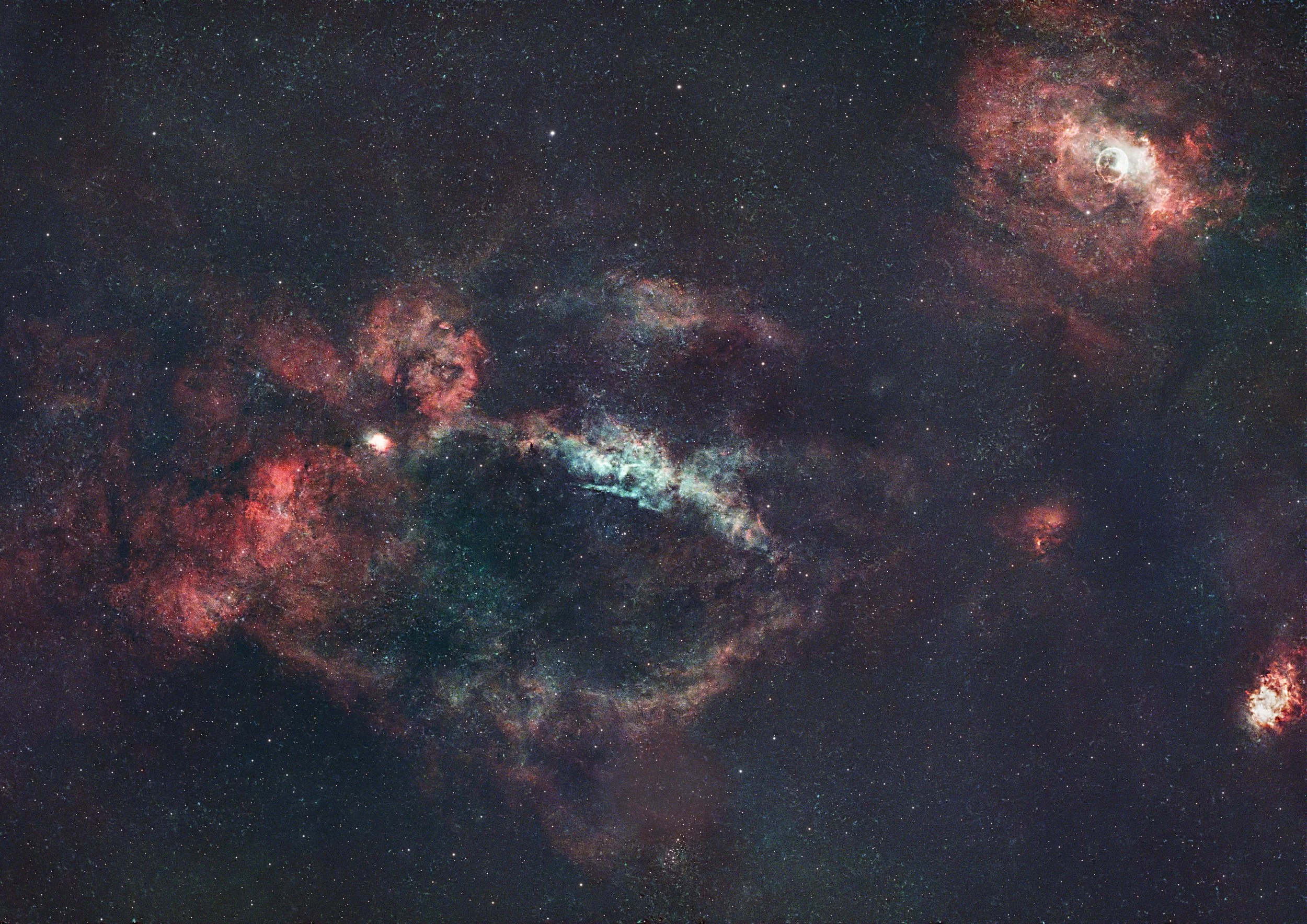 The Lobster Claw and Bubble nebulae, in the constellation Cassiopeia, about 11,000 light away.