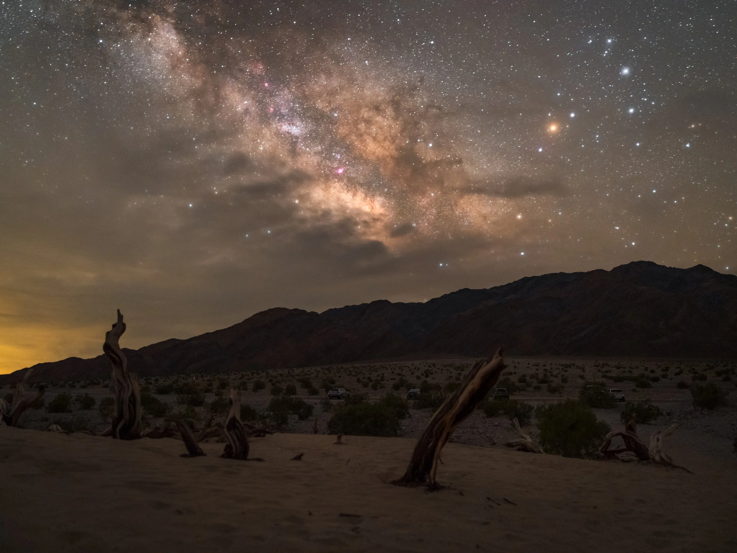 The Milky Way galactic core over Mesquite Dunes in Death Valley, California.  The Panamint Range mountains and Telescope Peak (11,049 feet) are in the background.