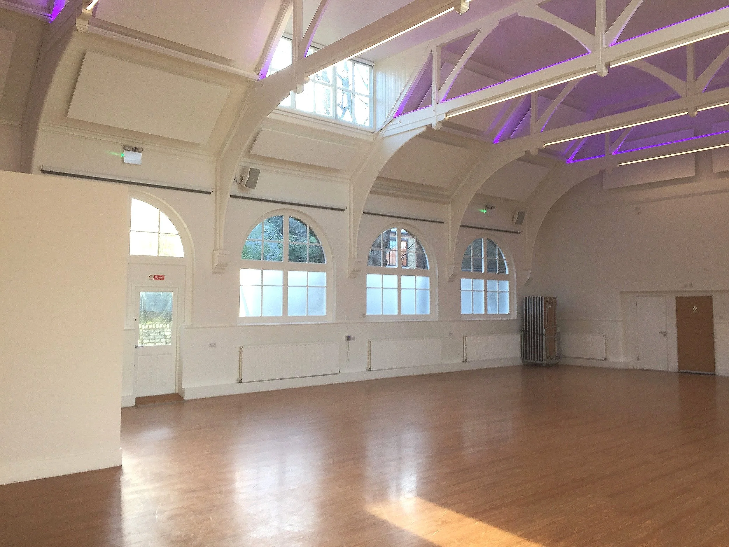 Trinity House hall, post decor with paint chosen to match acoustic panels