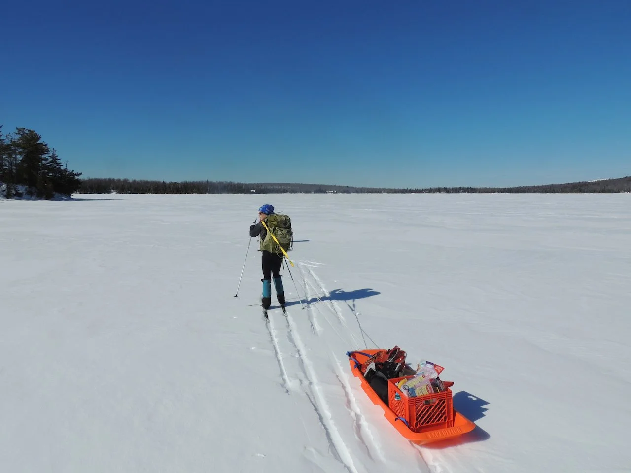 We access the cabin via skis or snowshoes, carrying our supplies in a backpack or sled (or both) for a 0.5 mile trip across frozen Lake Medora.
