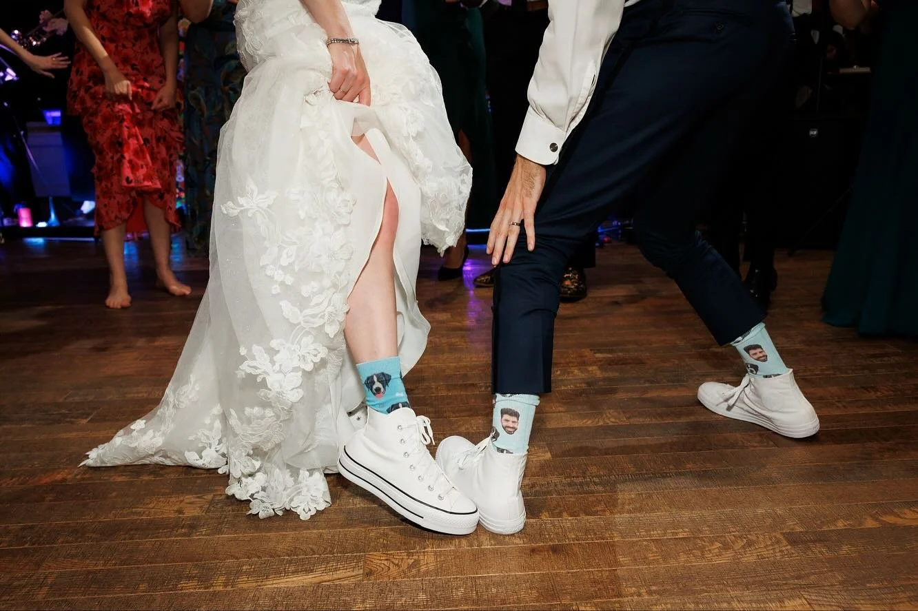 It&rsquo;s fun socks season: these were printed with the groom&rsquo;s face and the couple&rsquo;s dog (who unfortunately didn&rsquo;t get an invite) and were gifted to the family and wedding party who rocked them all night.