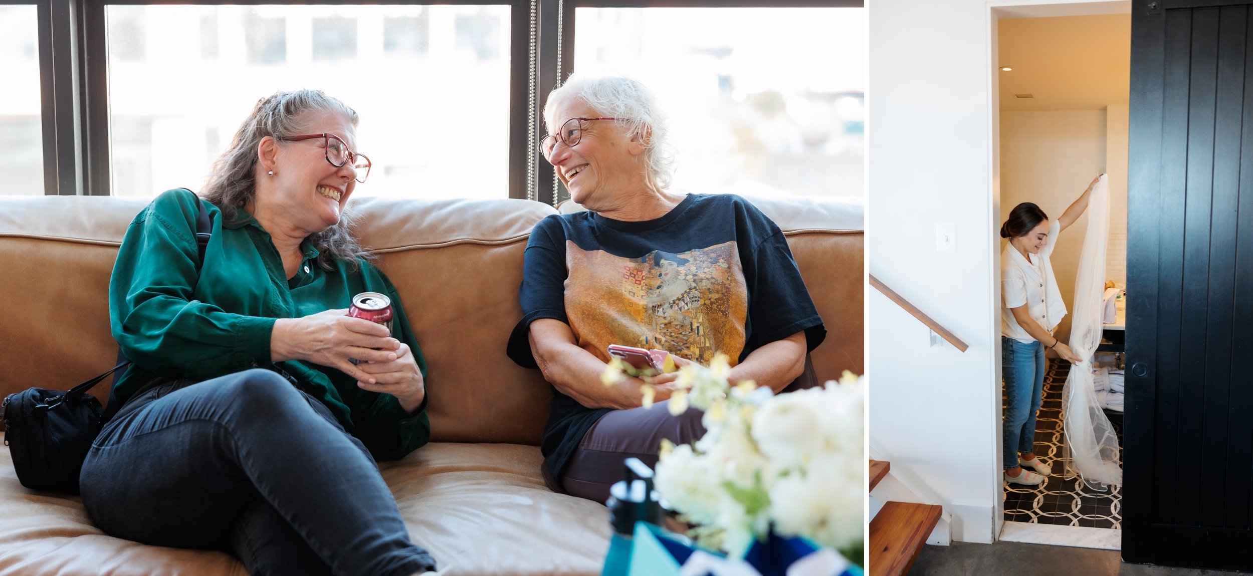  Two women laugh on the couch. The bride takes down her hanging veil 