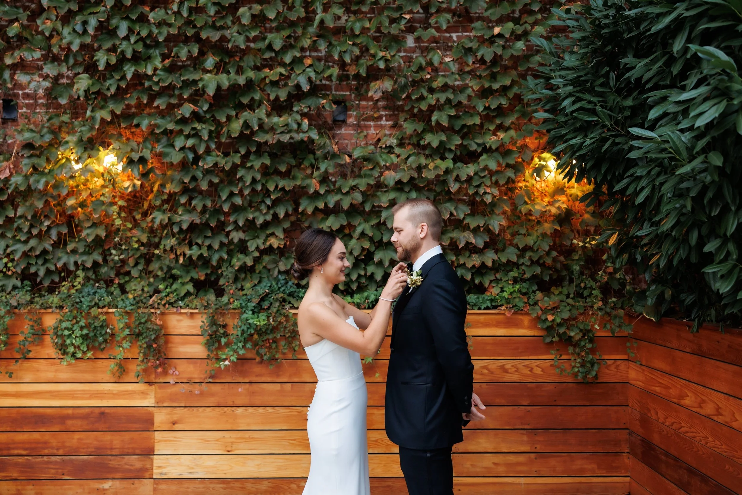  Bride adjusts groom’s tie 