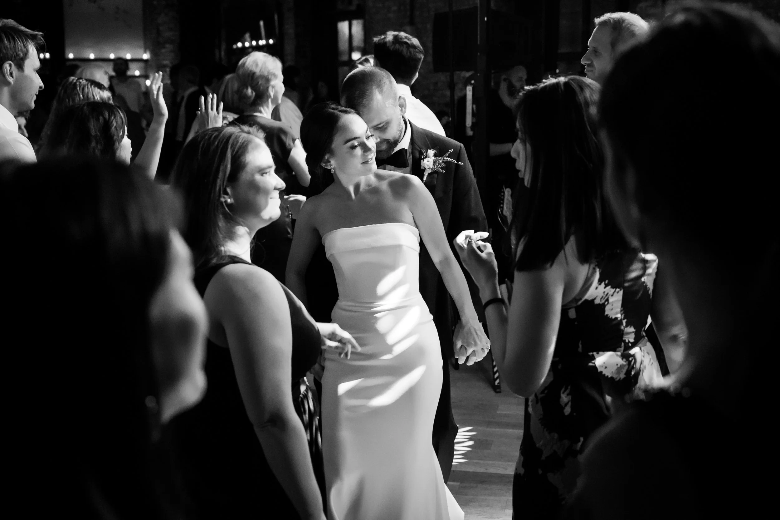  Couple shares an intimate moment on the dance floor during the wedding dance party 