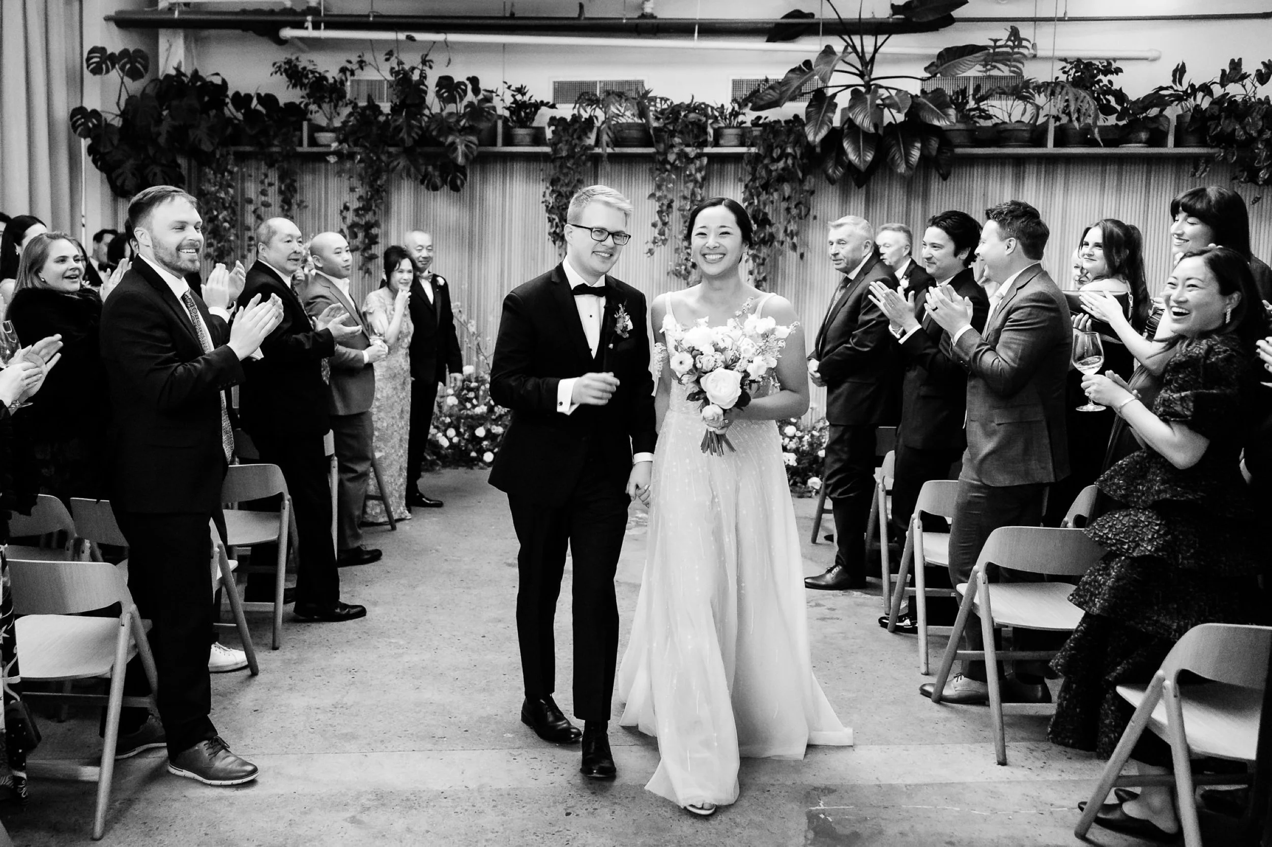 Couple walks back up the aisle after their ceremony at Rule of Thirds Brooklyn