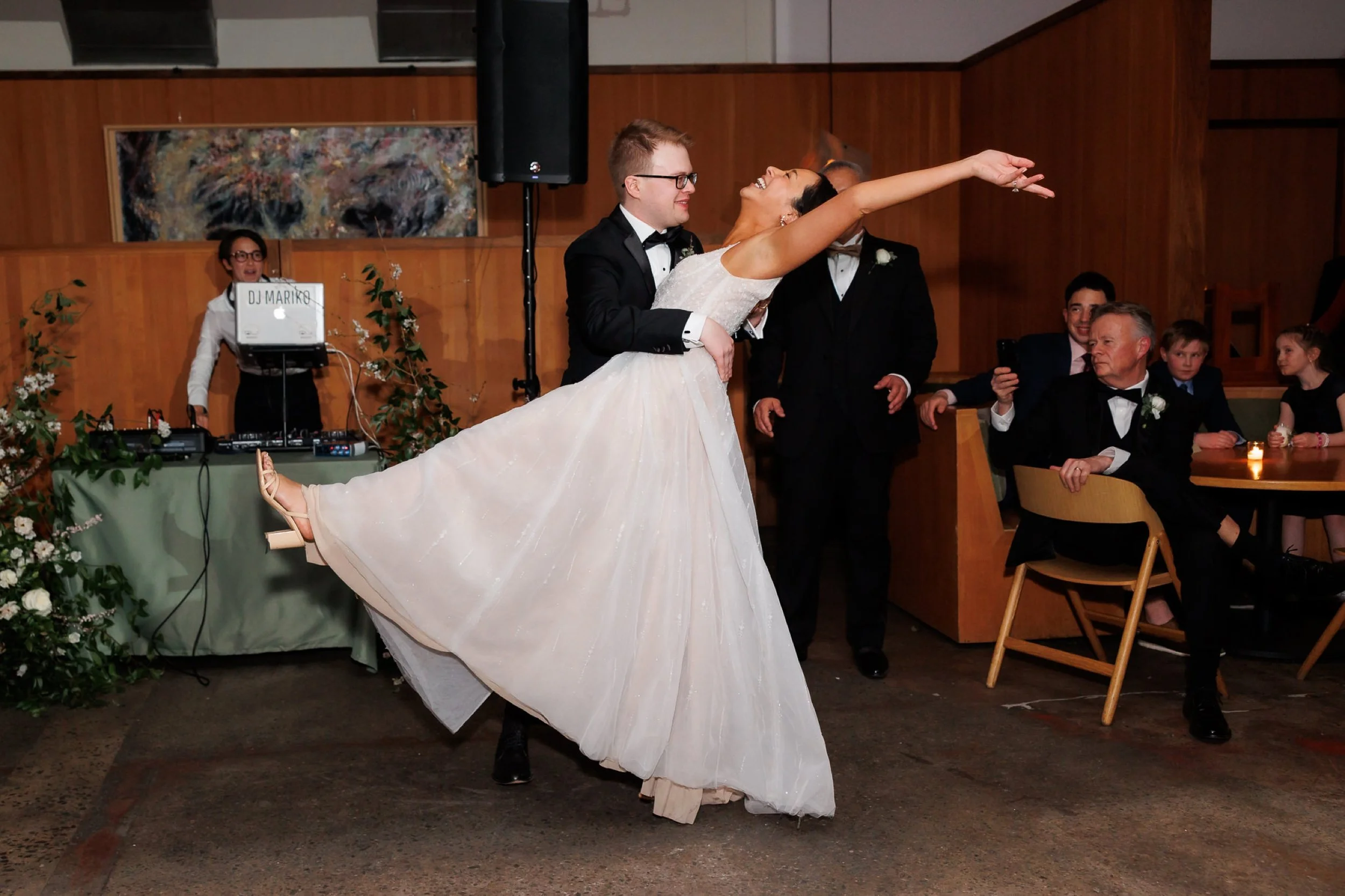 Groom dips bride for first dance