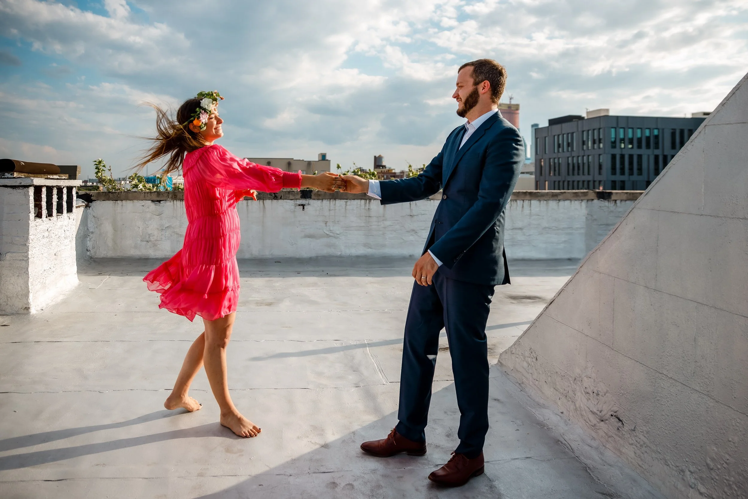 A couple dancing on a city rooftop