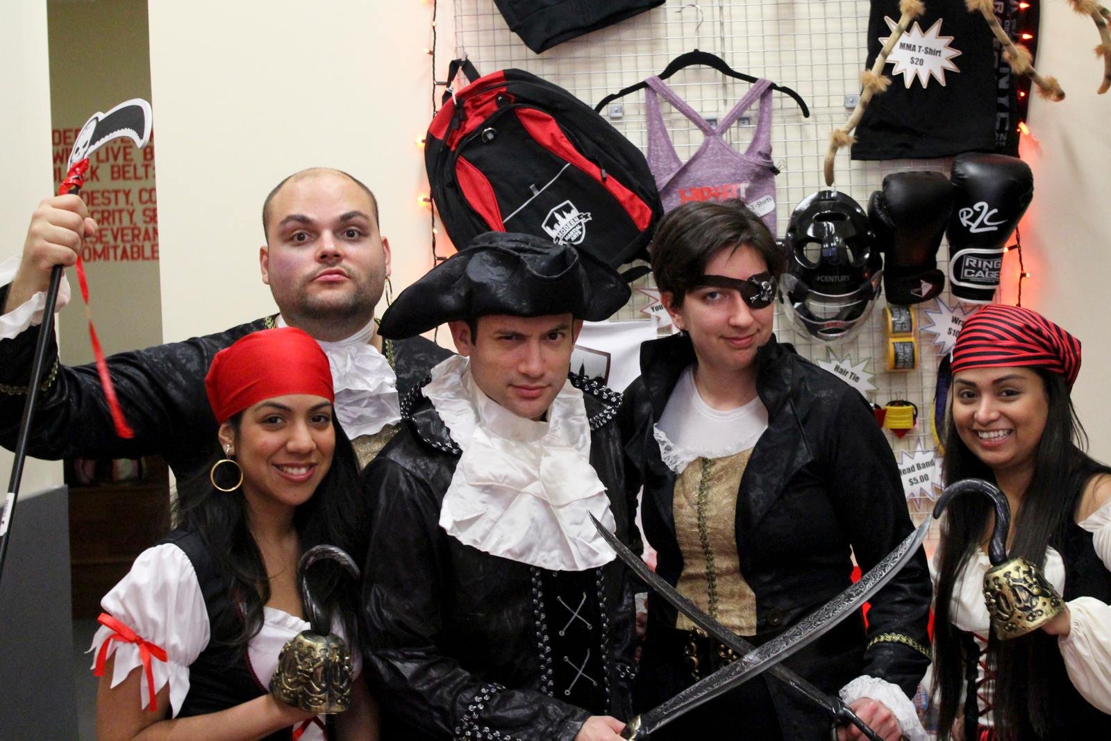 Group of five people in pirate costumes