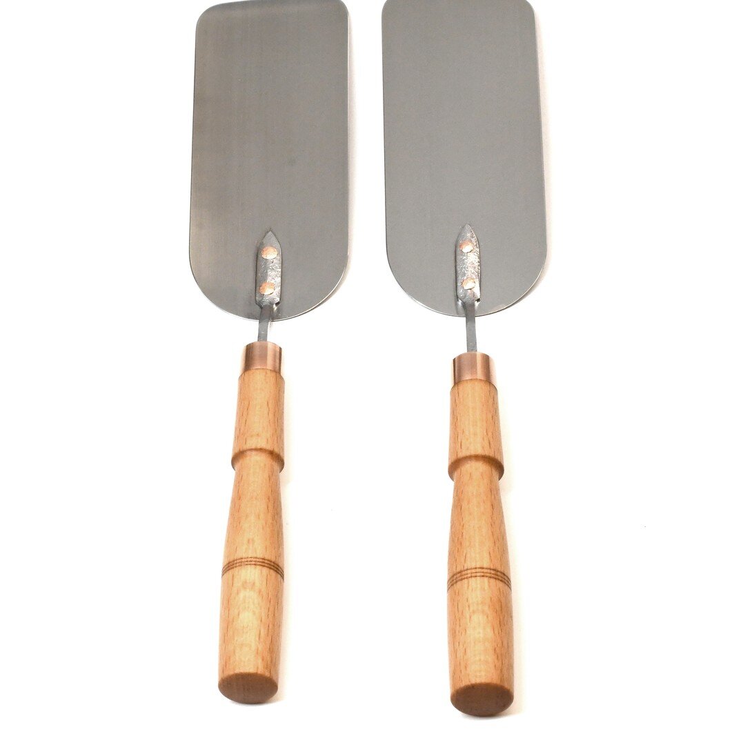 You can customize your spatula's blade to be angled for a right handed or left handed cook. We now also offer these beautiful turned wood handles with brass end caps and rivets!