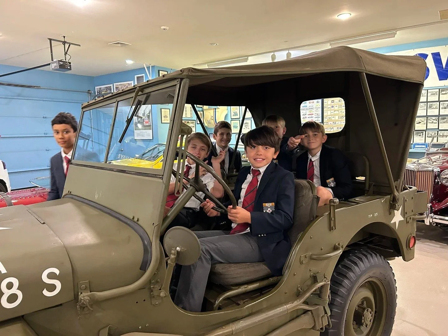 Boys in 5th and 6th Grade visited the Malcolm Pray Achievement Center, a premier car museum in Bedford, NY. Students got an up-close look at a rare collection of vintage automobiles and learned about their history and mechanics from museum staff. A g