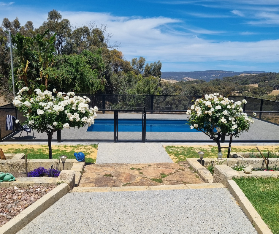 Fibreglass pool with valley views and exposed aggregate surrounds in West Toodyay